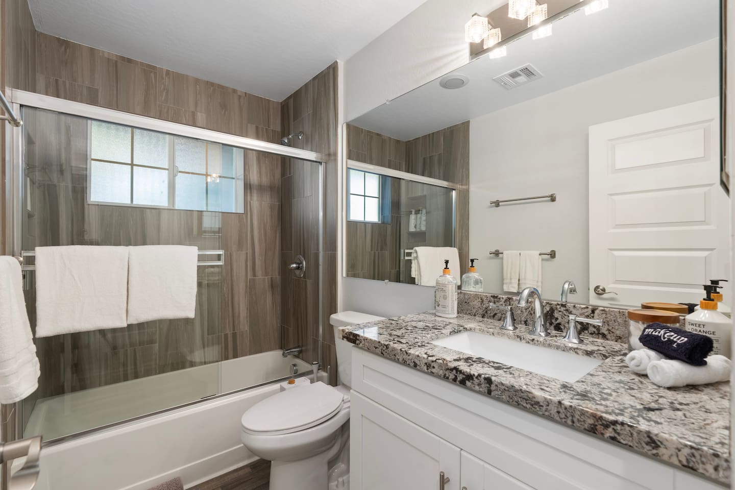 Modern full bathroom equipped with sleek fixtures, a spacious shower, and contemporary design for a luxurious experience.