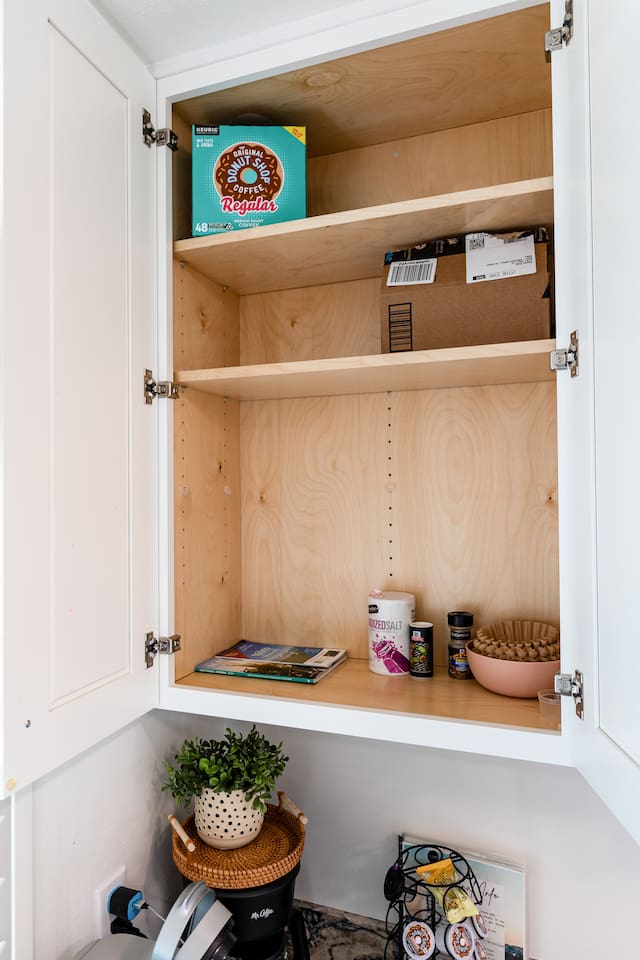 Open cabinets reveal pantry staples, cooking basics, and spices to make you feel right at home.


