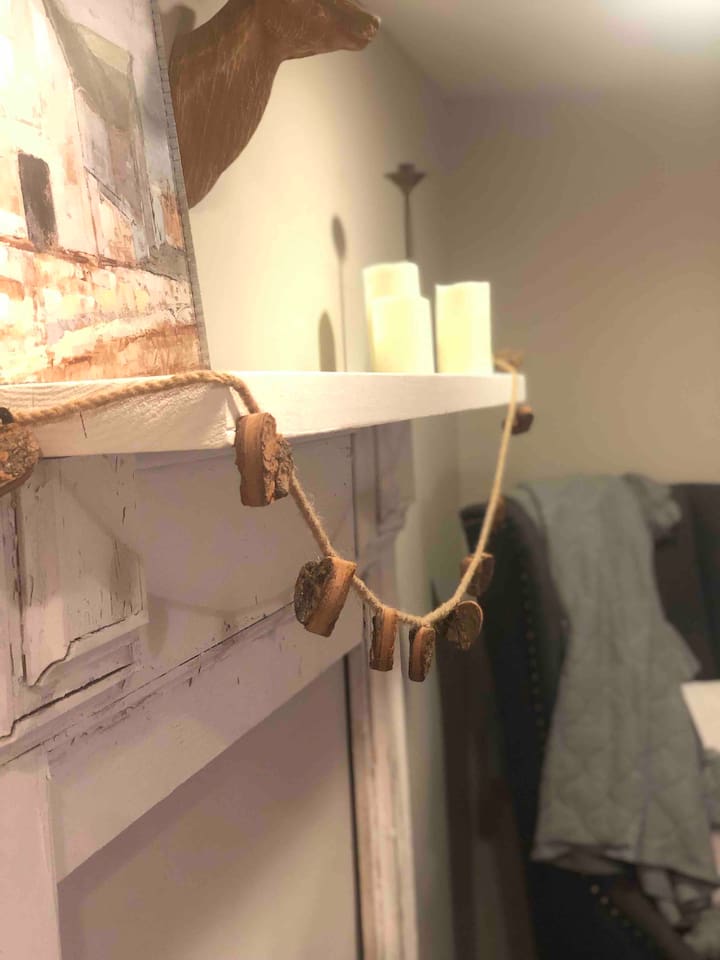 Antique mantle (repurposed from 1940 Christmastown/McAdenvillle home) in the Master bedroom adds to the charm!