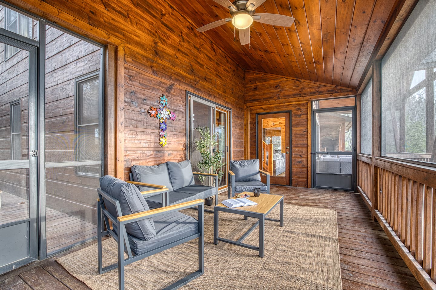 Mountain views from the wrap-around porch, especially the screened in porch in the back with comfy cozy outdoor furniture. 