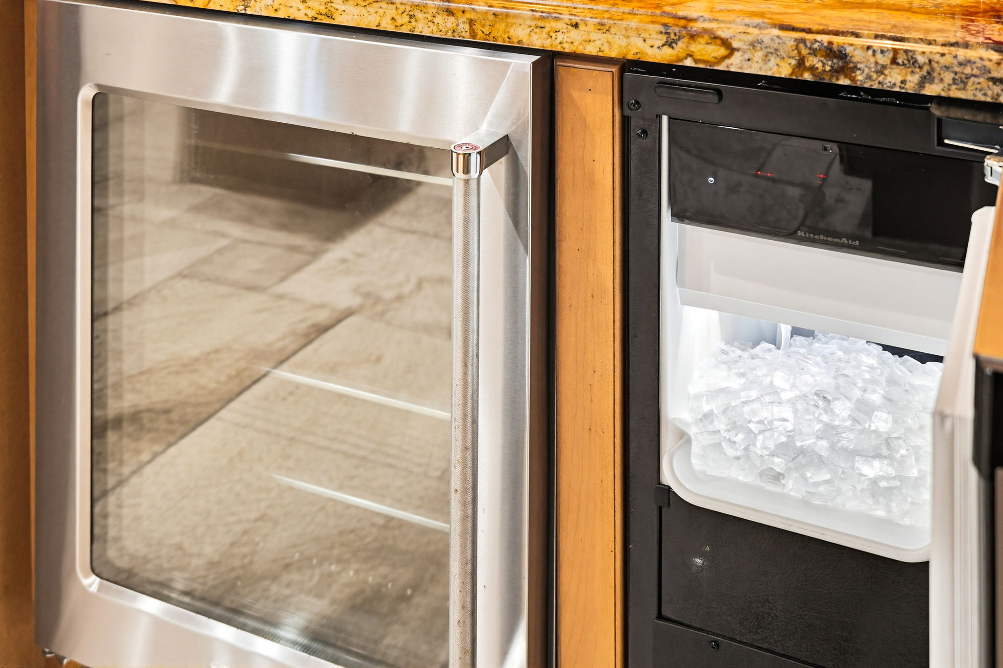 A wine refrigerator and ice maker.