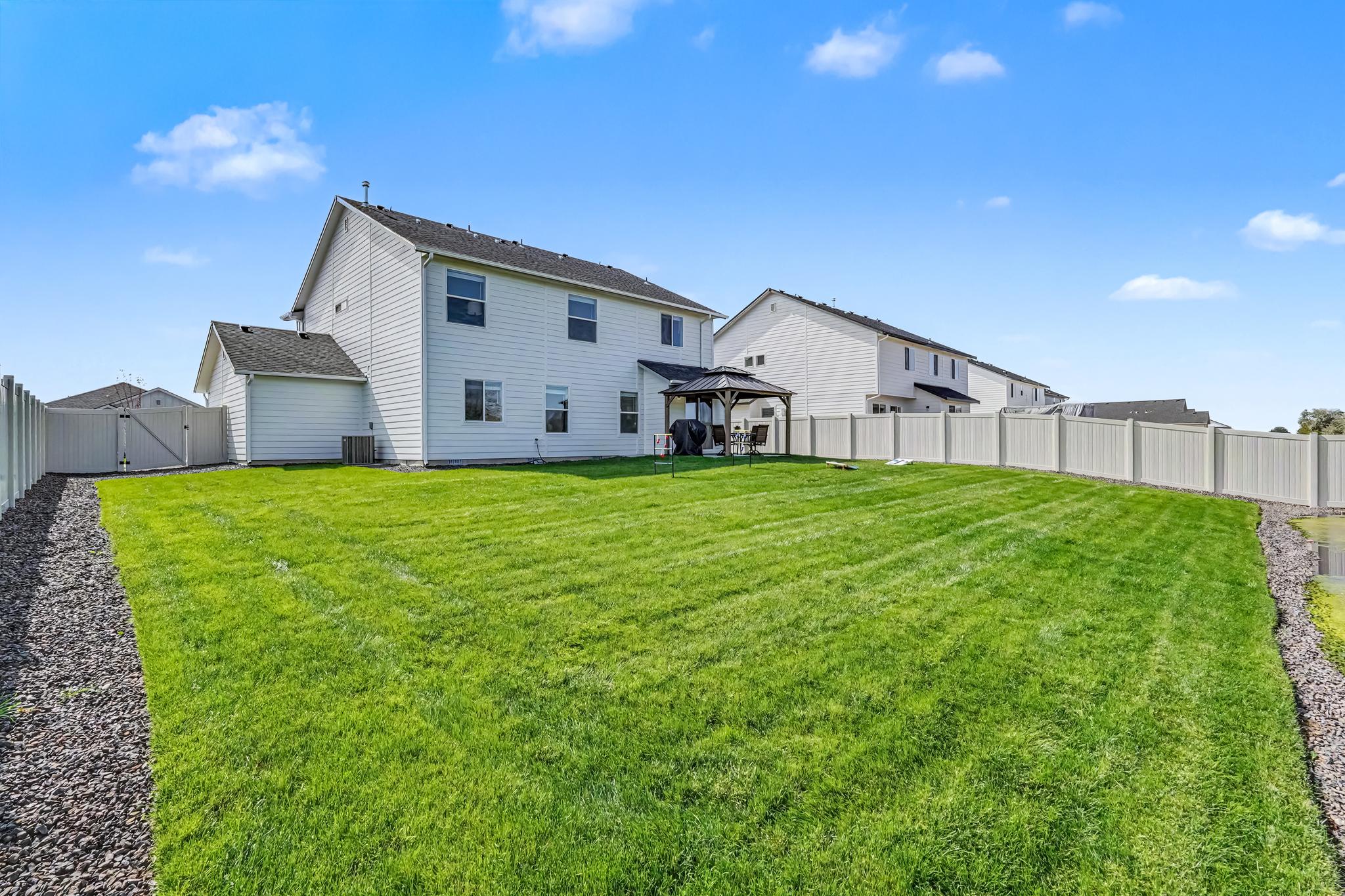 Just look at this backyard. So much space for yard games or hosting family BBQs.