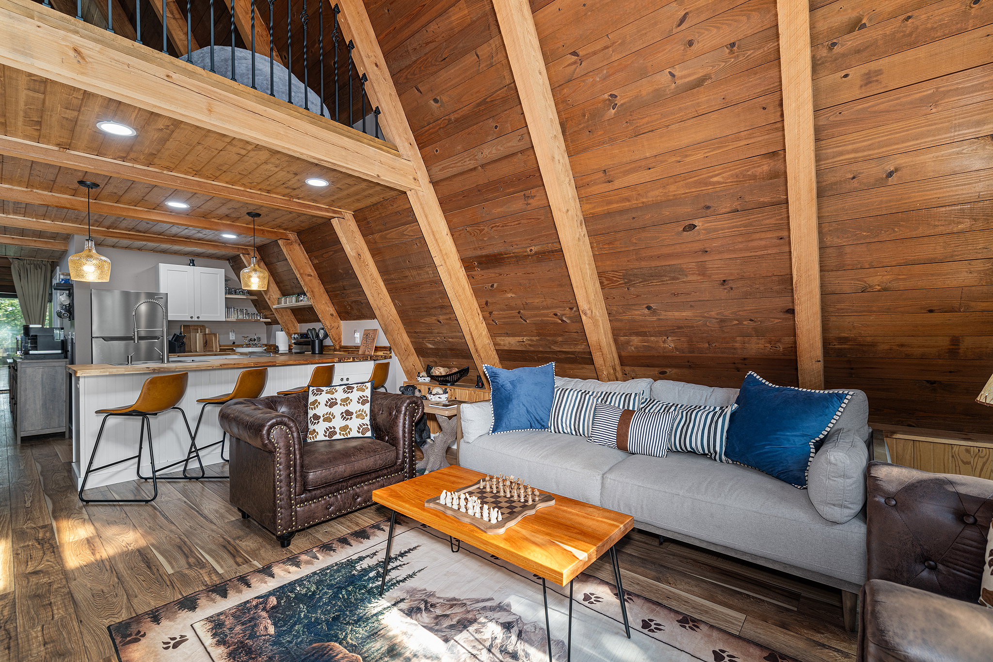 Warm, woodsy living room where game nights and laughter happen.