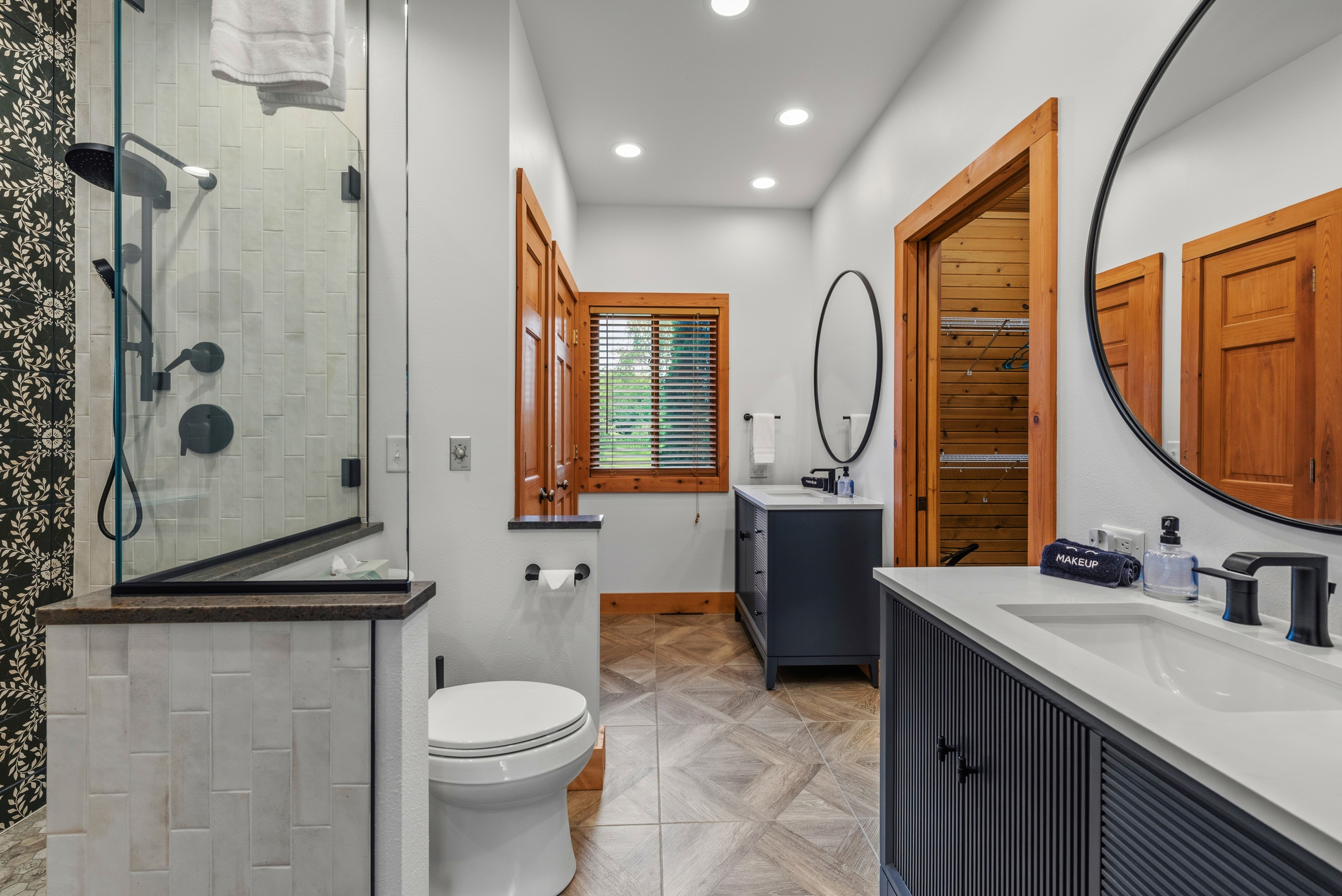 Newly installed vanities, Kohler faucets and tile floors in the main floor Master Suite.