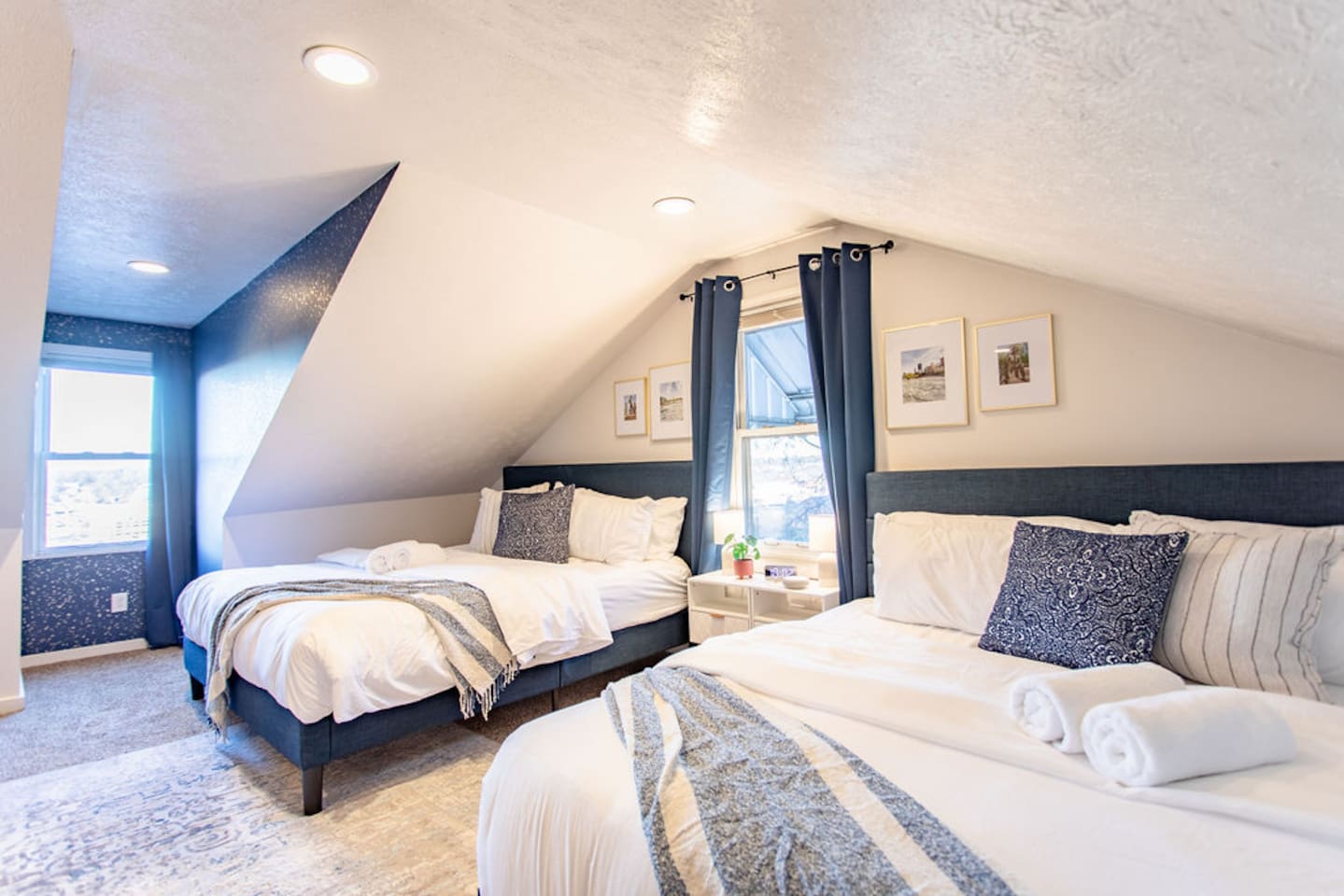 Spacious bedroom featuring two king beds, offering ample comfort and plenty of space for families or groups looking to relax together.