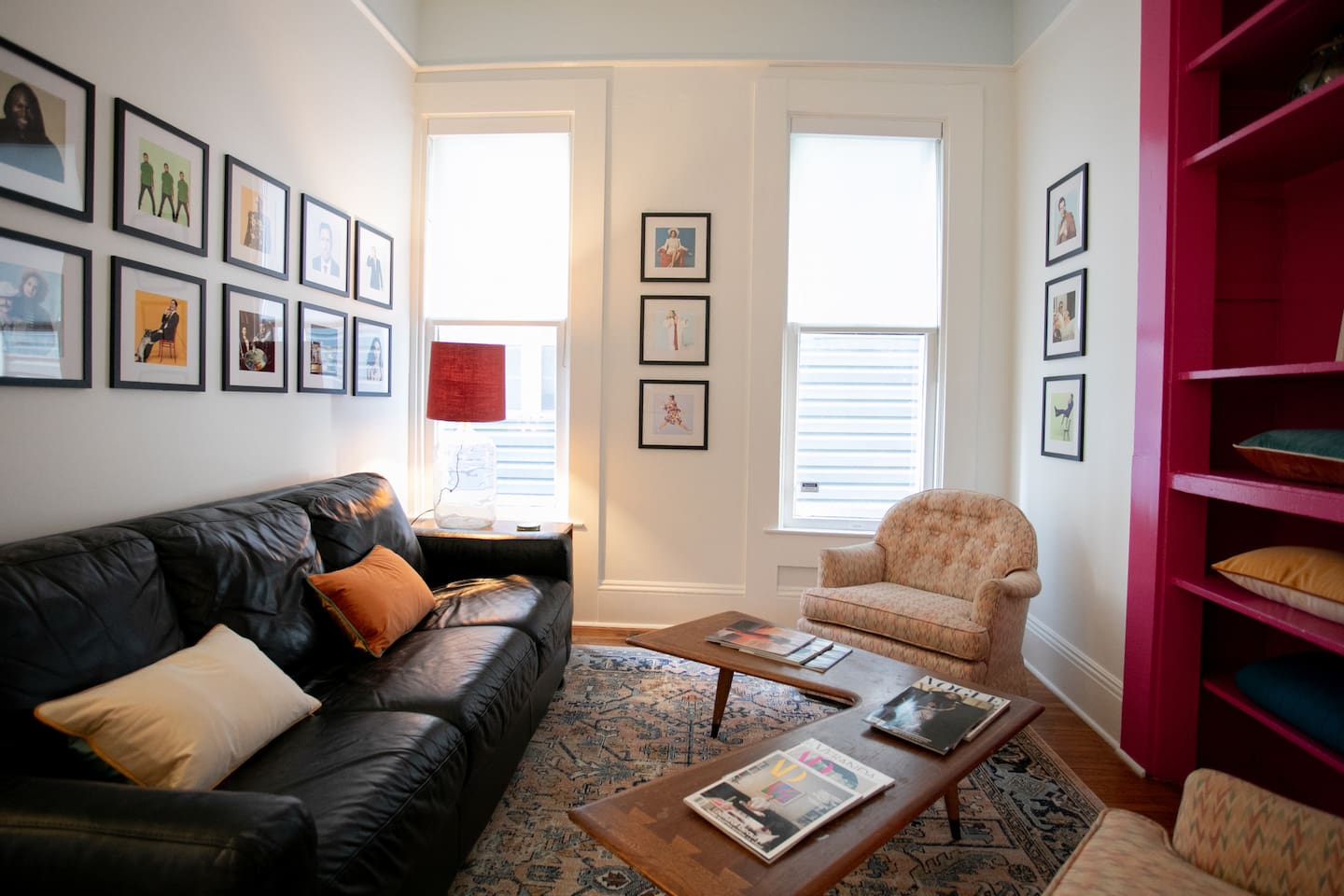 Ridiculously comfortable leather sofa layered with velvety-soft pillows and cozy blankets — designed for long afternoon reads and even longer naps.