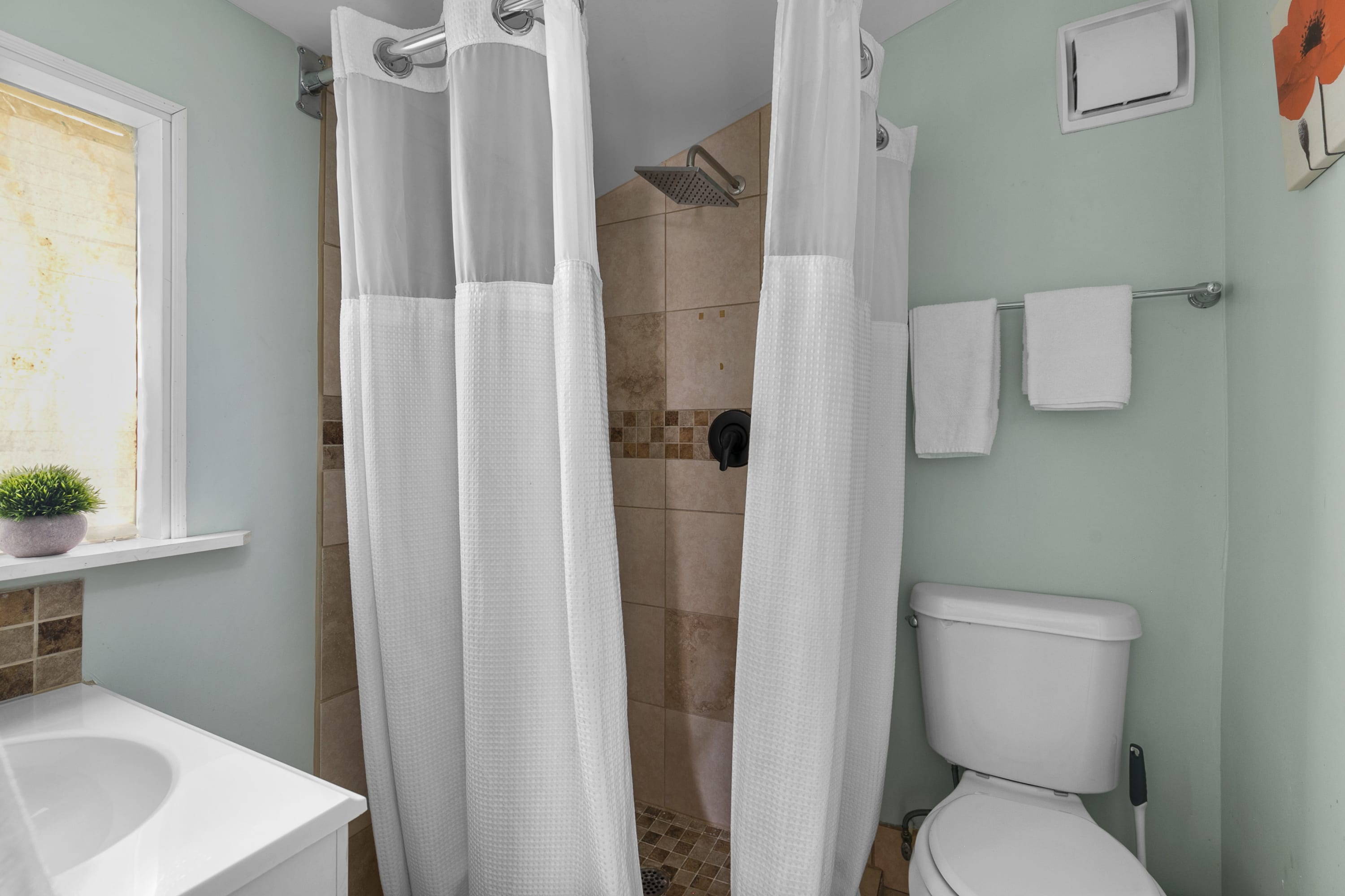 Refresh and reset in a clean, walk-in shower designed for easy comfort.