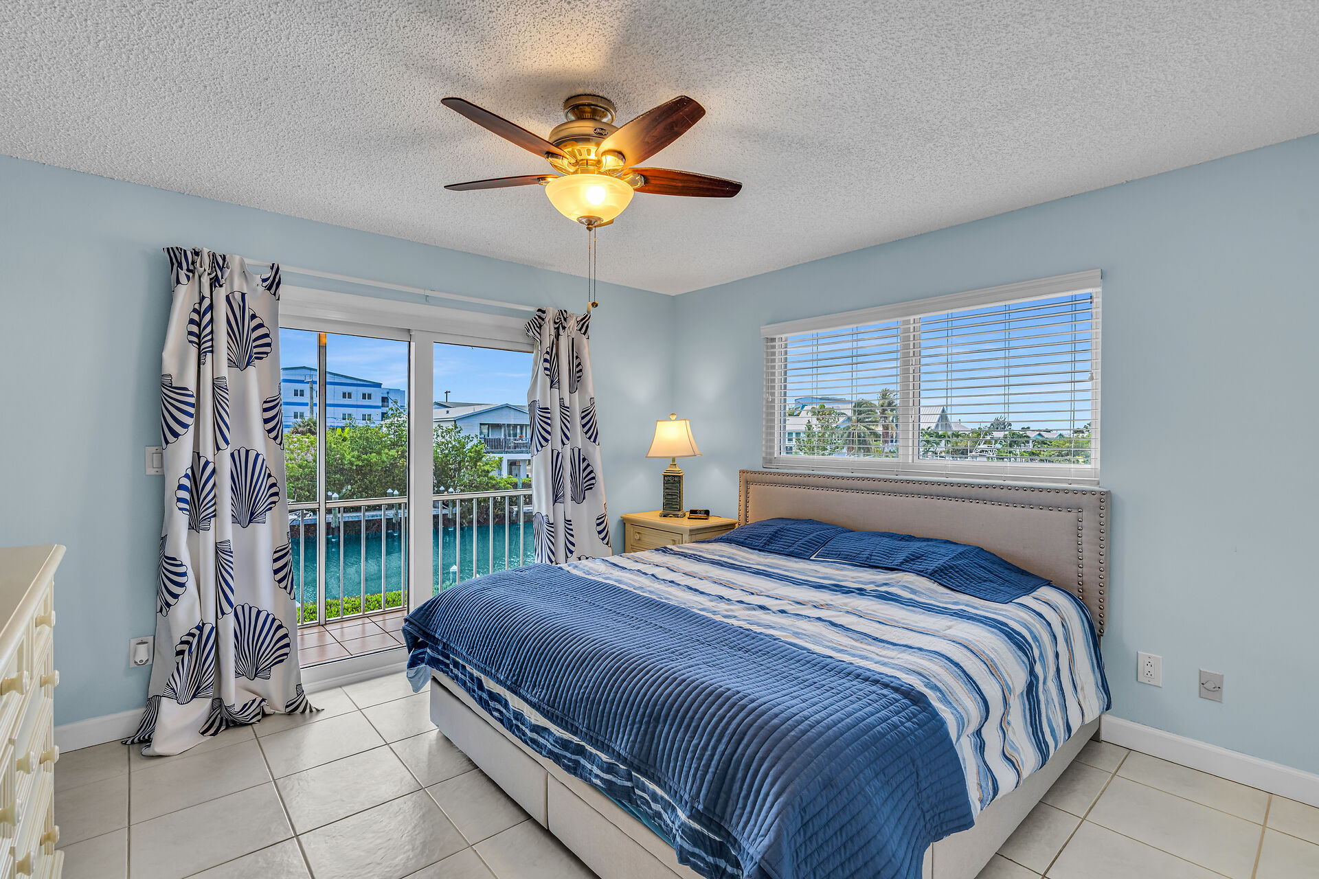 Primary bedroom overlooking waterway