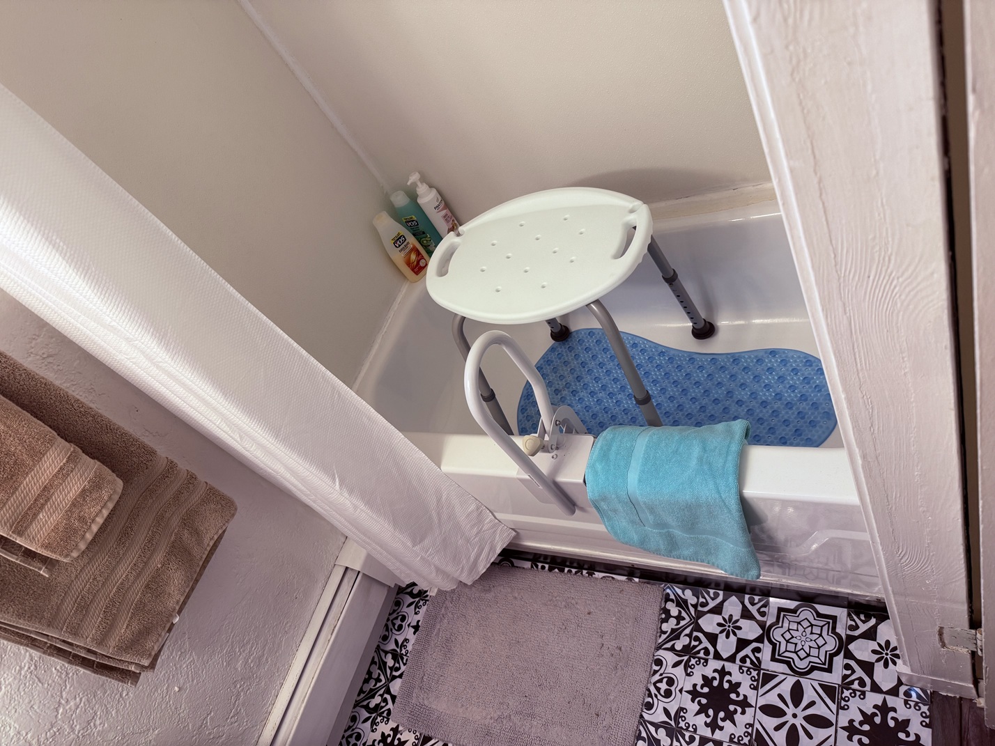 Bathroom with shower seat + mat “Accessible Tub With Safety Gear