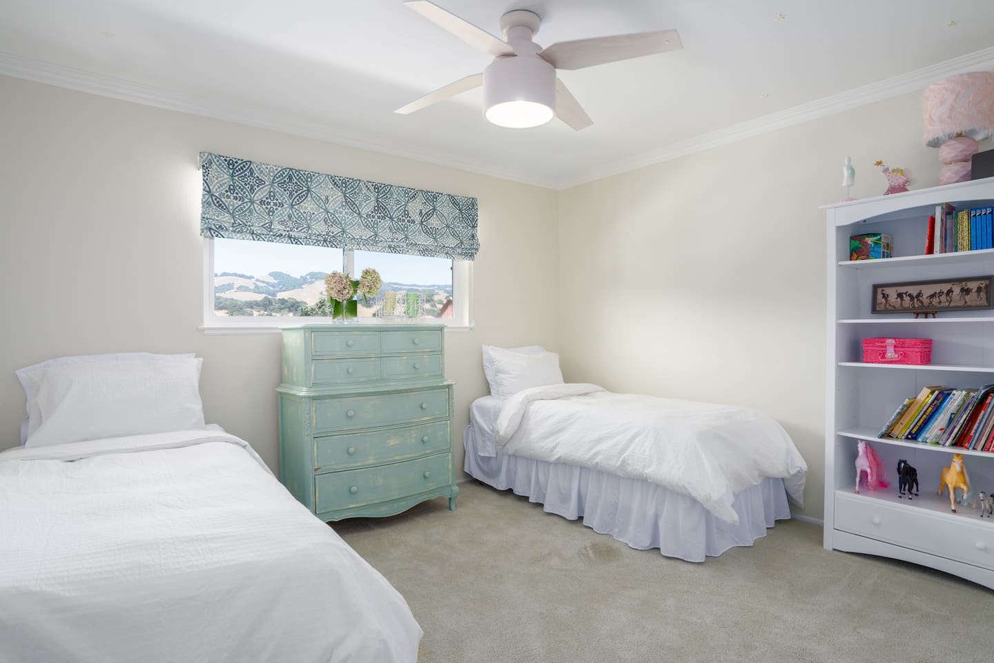  An appointed bedroom featuring twin beds.