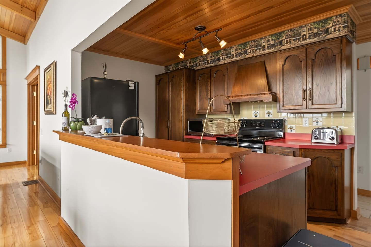 Fully equipped kitchen and coffee station with drip coffee maker, Keurig (K-cup), and tea setup—complete with spices, cookware, kid-friendly dishes, and beautiful tableware, making it easy to prepare anything from morning coffee to family meals