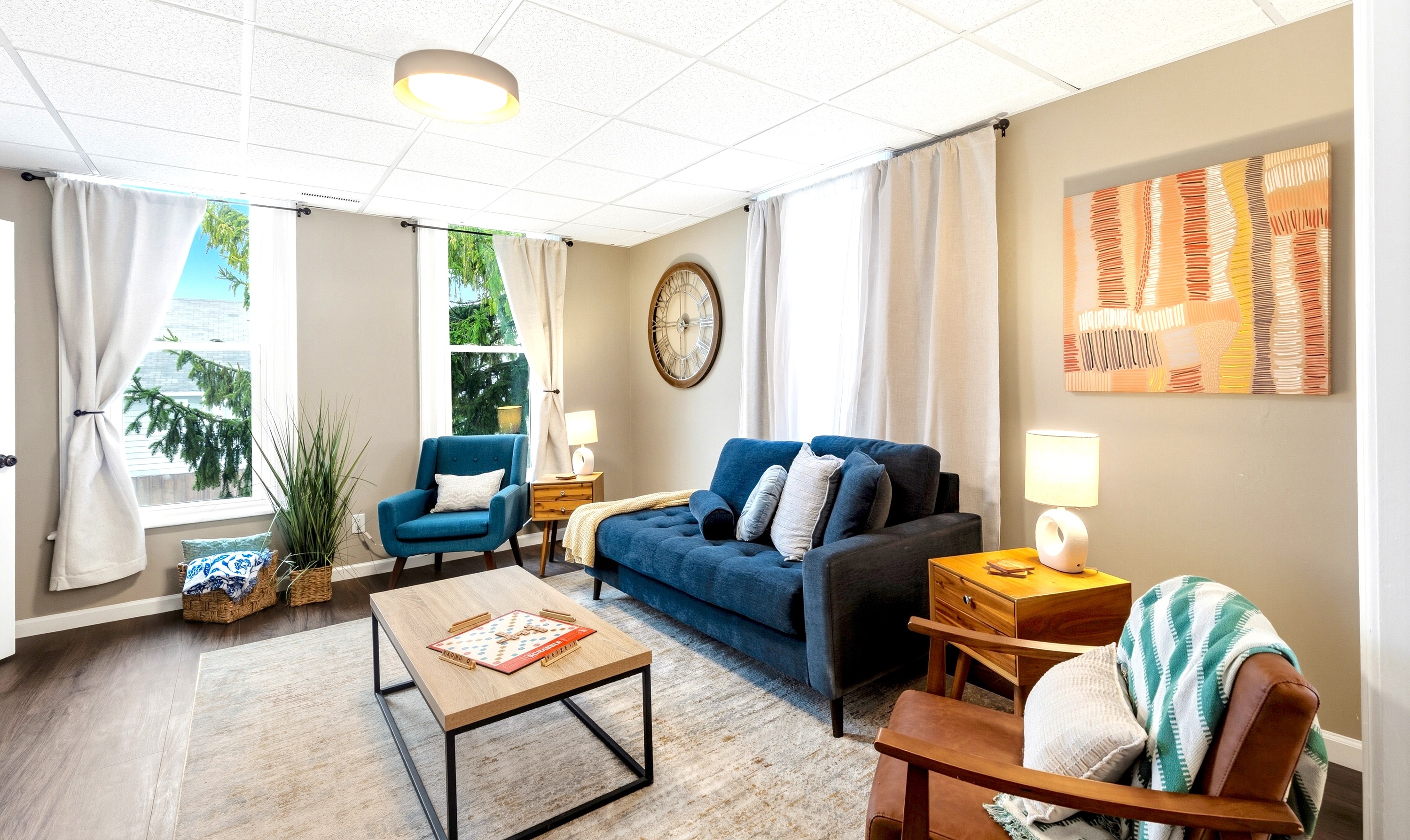The open layout connects the living room, dining area, and play room so everyone can hang out together