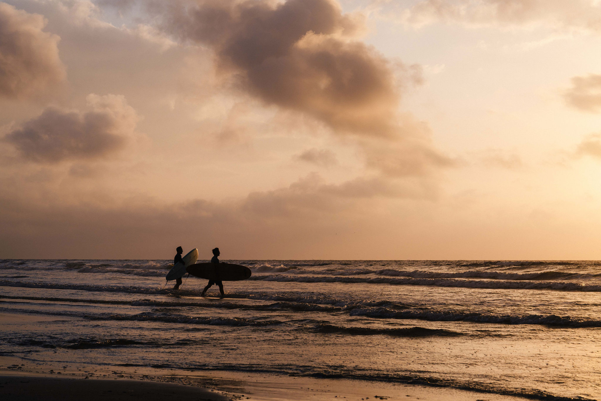 Sunset surf session — the Gulf delivers this most nights of the year.