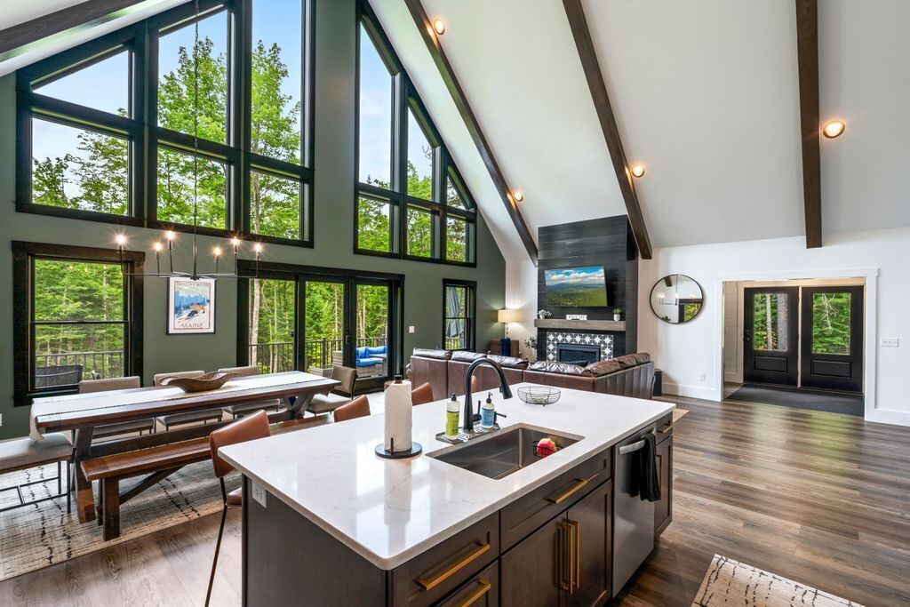 Where everyone gathers—and no one feels crowded. With forest views, soaring windows, and space to cook, dine, and unwind together, this is the heart of Sunday Basecamp.