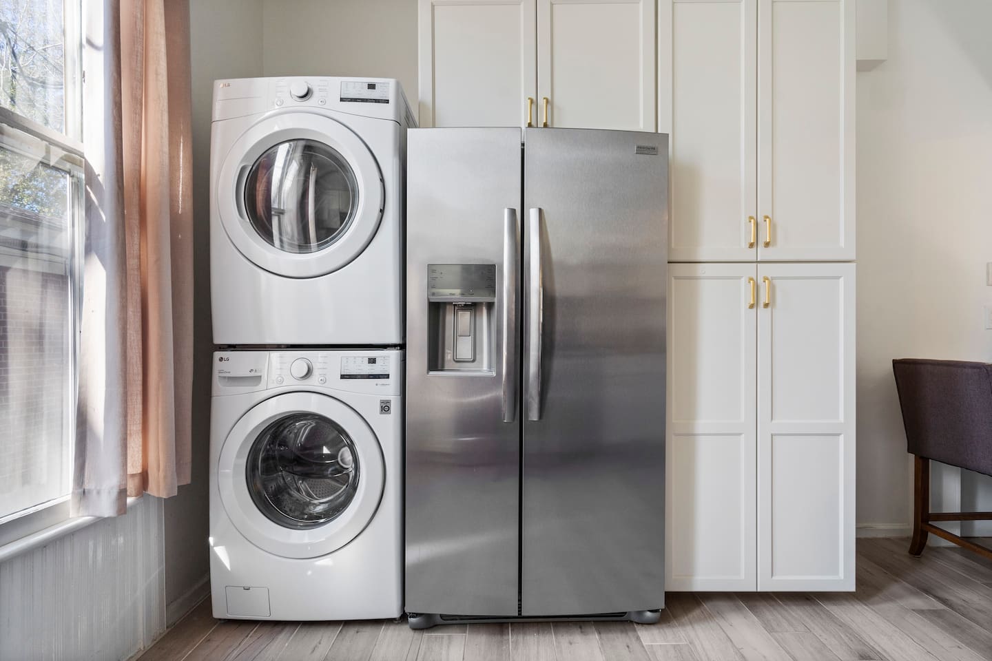 In-unit stacked washer and dryer — a rare find in a historic downtown rental