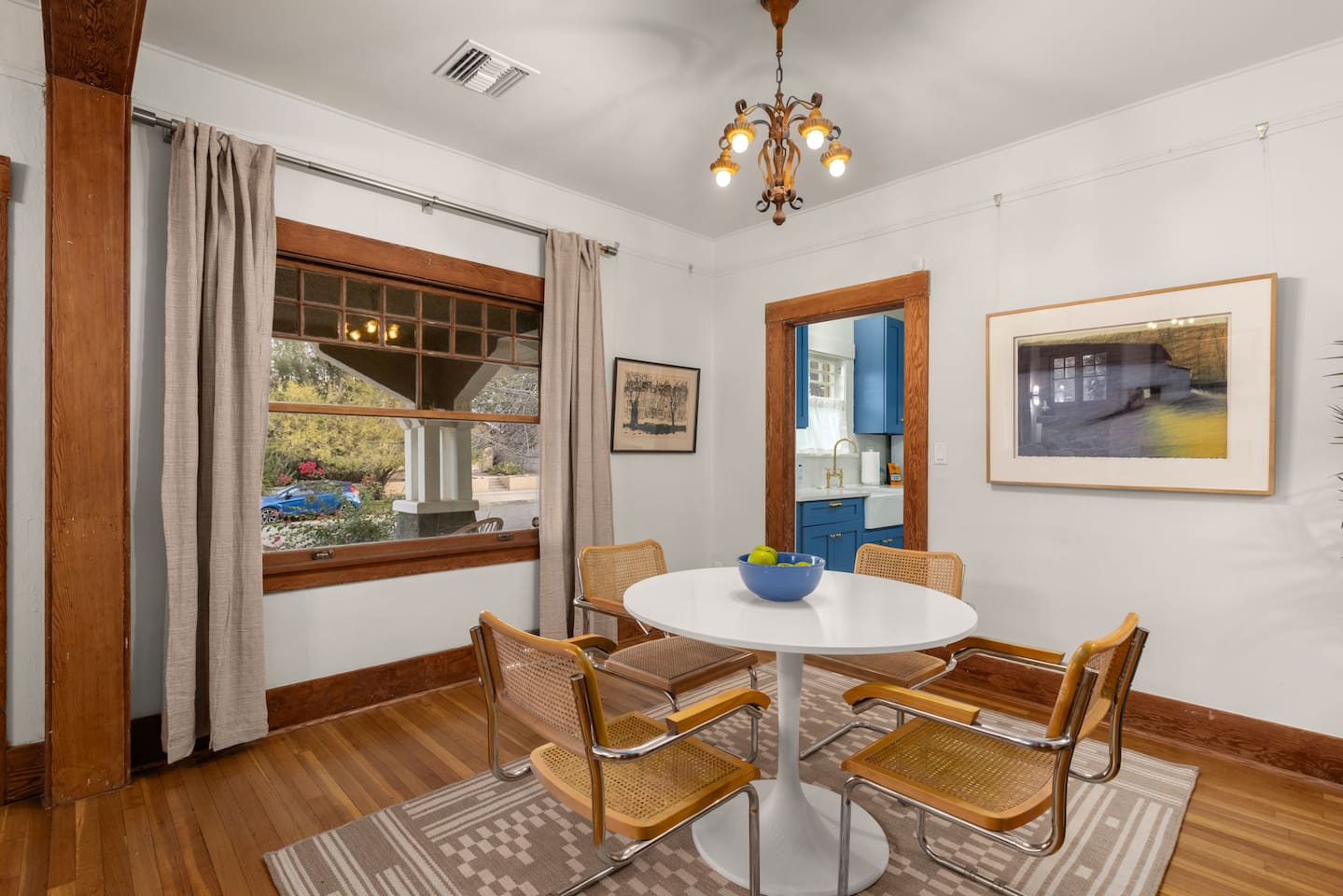 dining room with vintage window looking out to the front porch