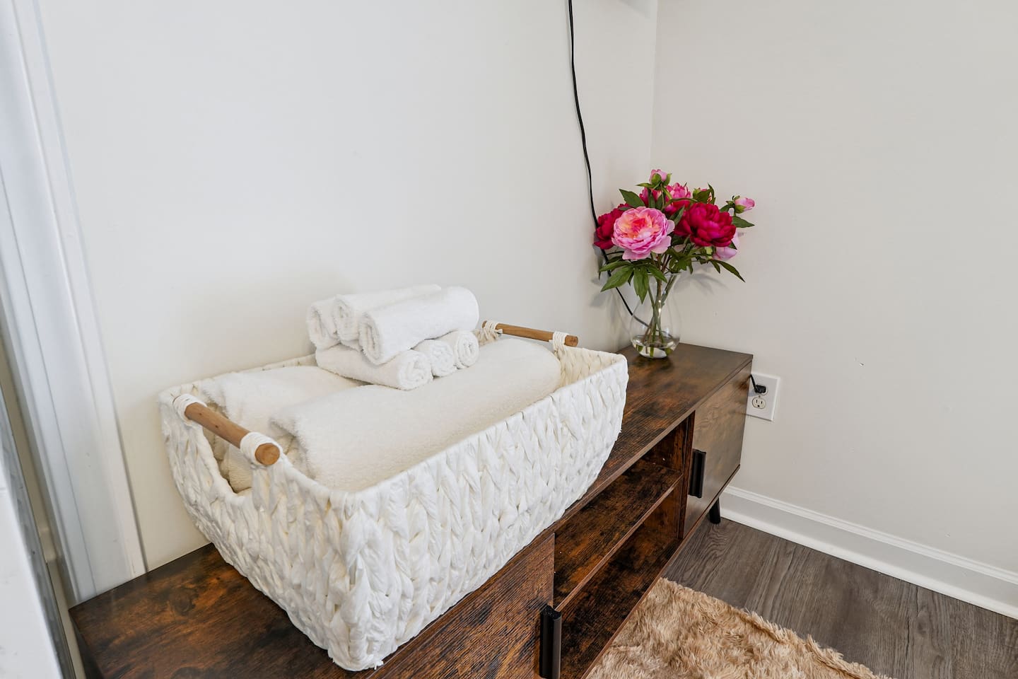 Another cozy bedroom featuring both a full bed and a twin bed, along with an Amazon Fire-powered Smart TV for your entertainment. This room includes 4 full-body towels, 4 washcloths, and 2 hand towels for your stay.