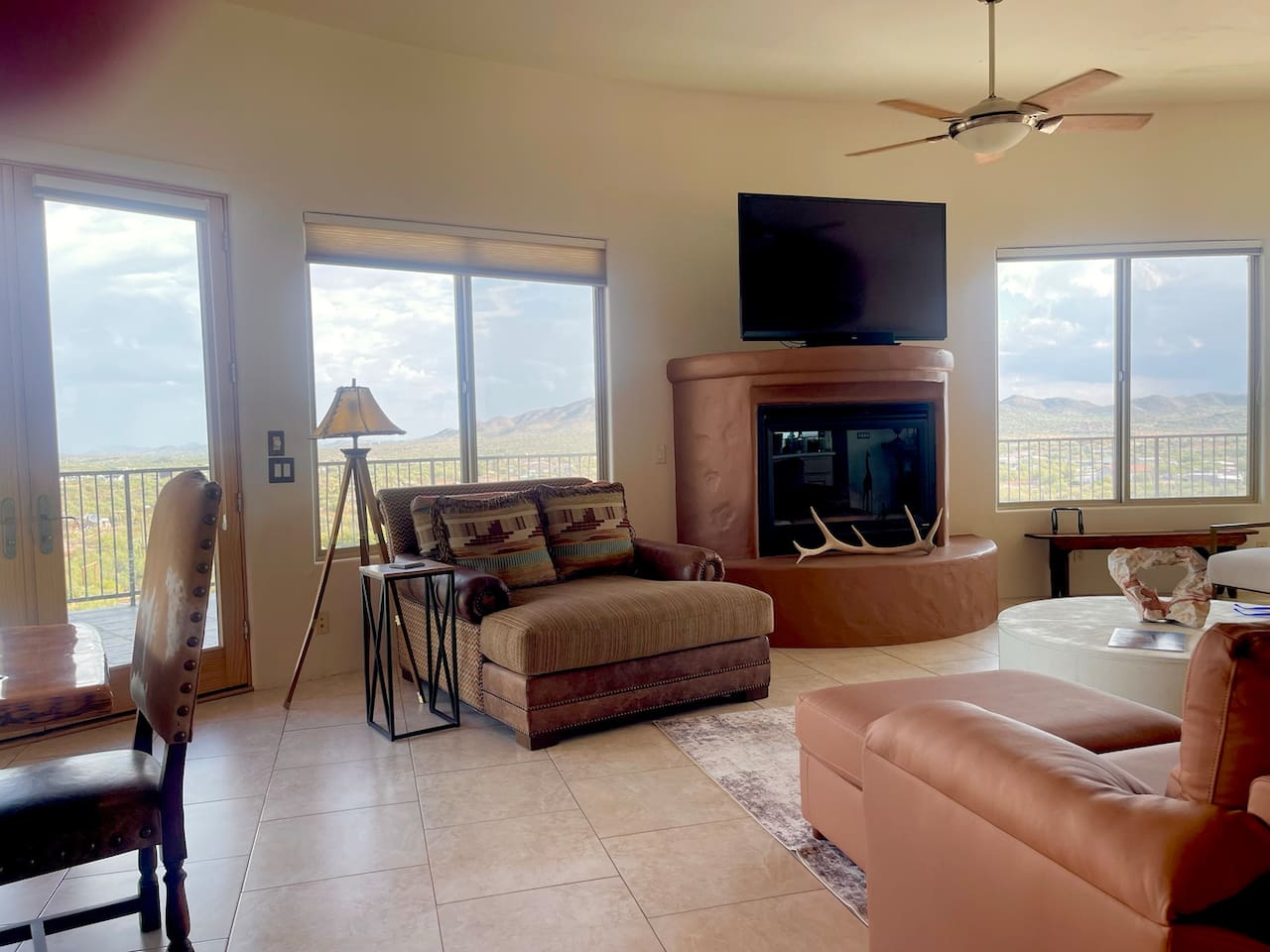 A cozy chaise by the fireplace gives you a comfortable spot for TV time or a quiet break.