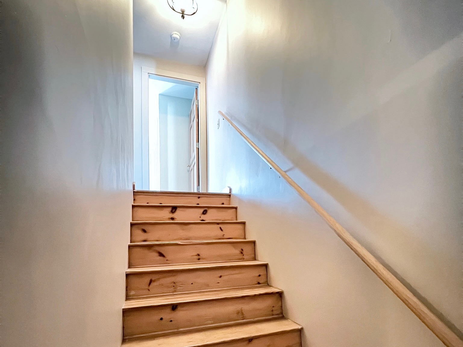 The interior staircase leads you to the quiet sleeping quarters on the second floor.