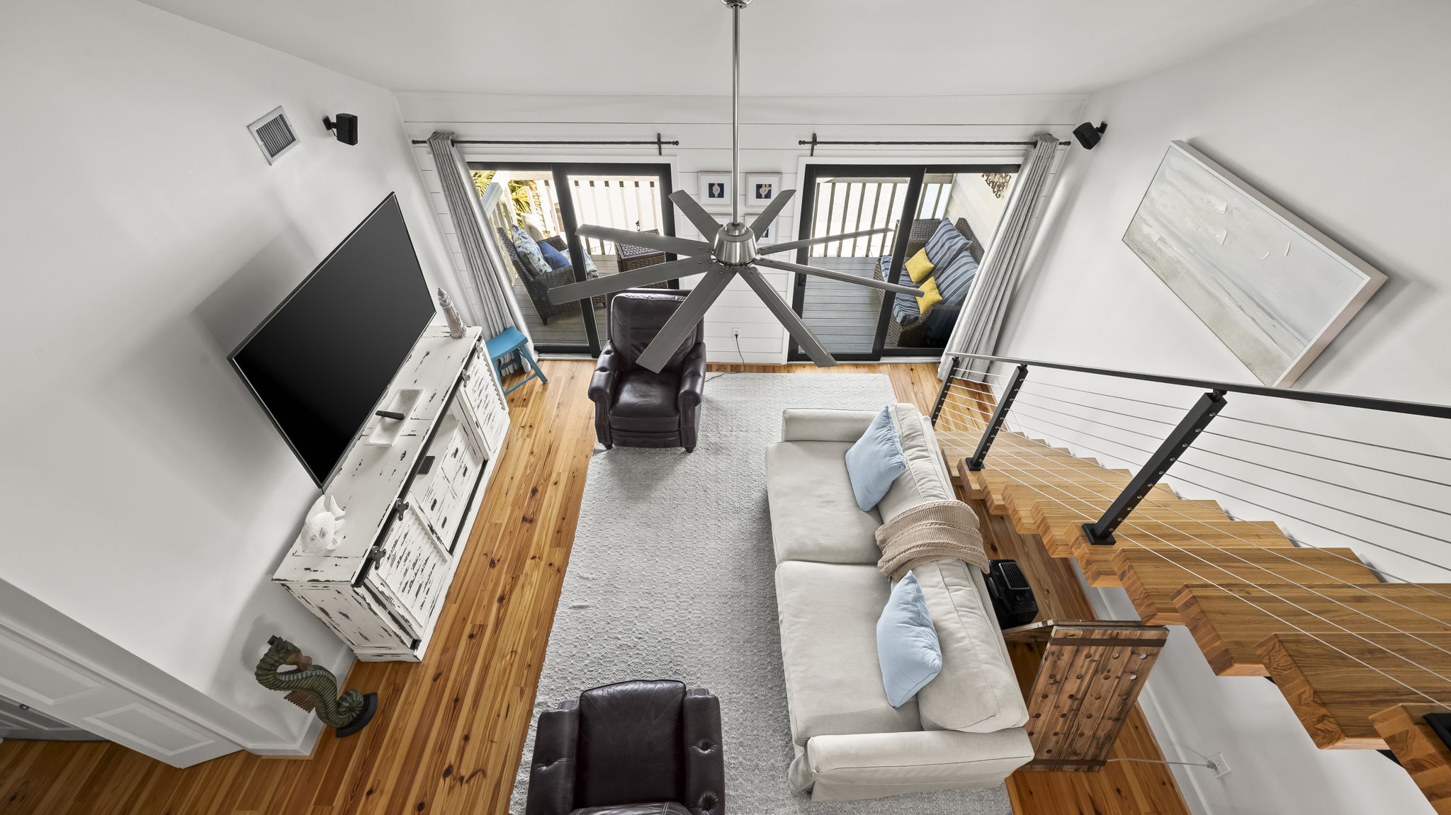 Gather in the spacious living room of our Cotton Bayou condo, complete with a smart TV, comfortable seating, and coastal-inspired decor. It's the perfect place to relax after a day by the pool or exploring the ba