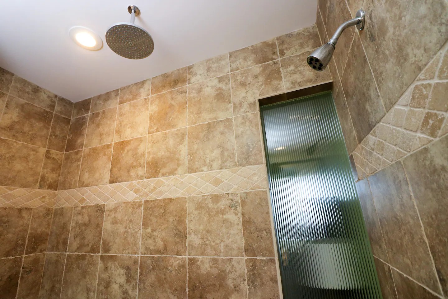 Another view of walk-in shower with rain shower head