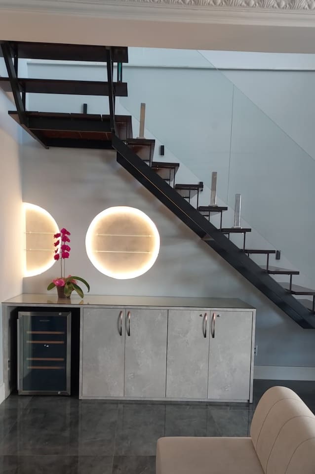 LED lighting accents many of the spaces, including this wine area, bathrooms, sauna, terrace, and more!