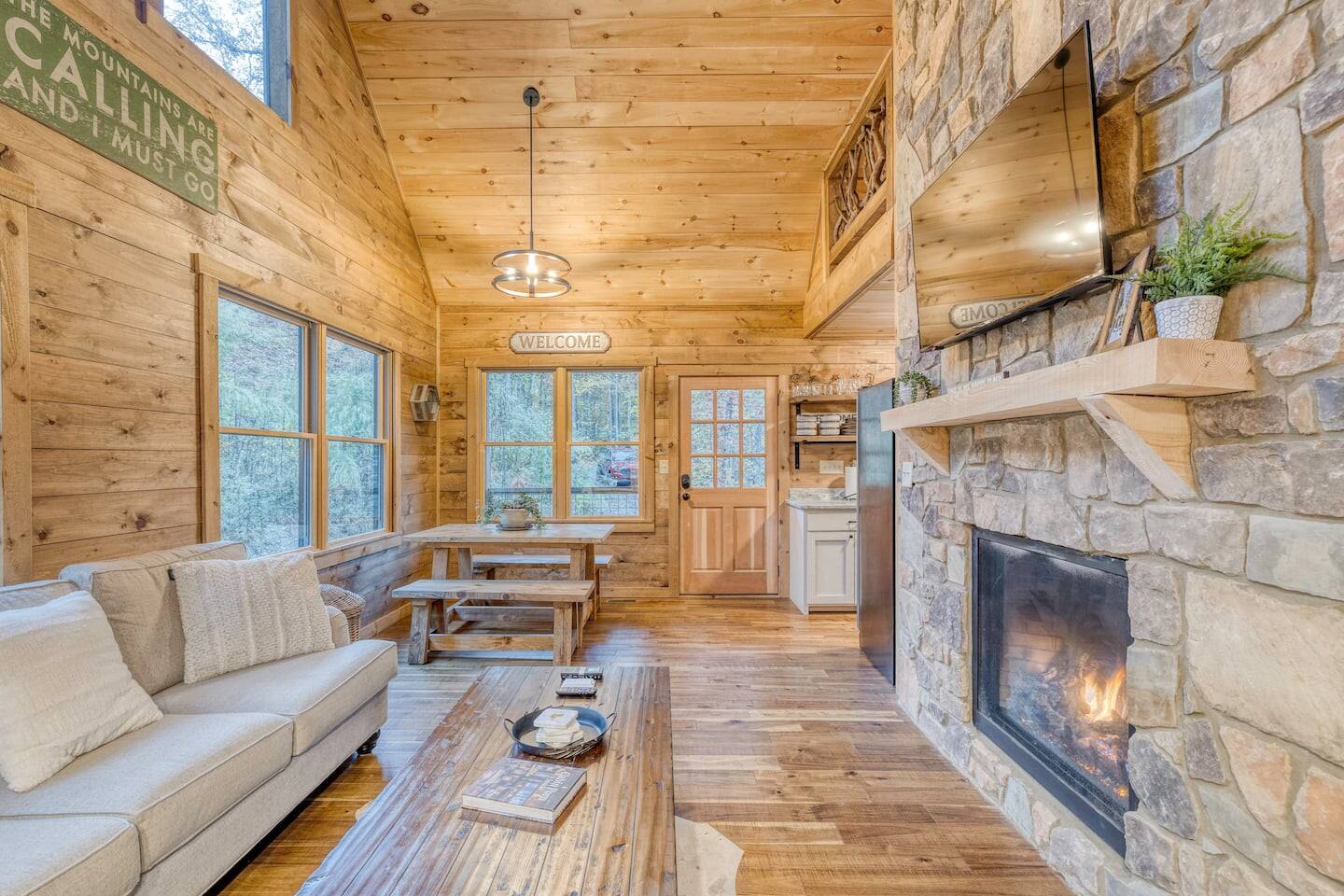 Our fireplace, nestled beneath the glow of the flat screen TV, creates the perfect setting for warm gatherings and relaxed entertainment, where flickering flames meet captivating stories.