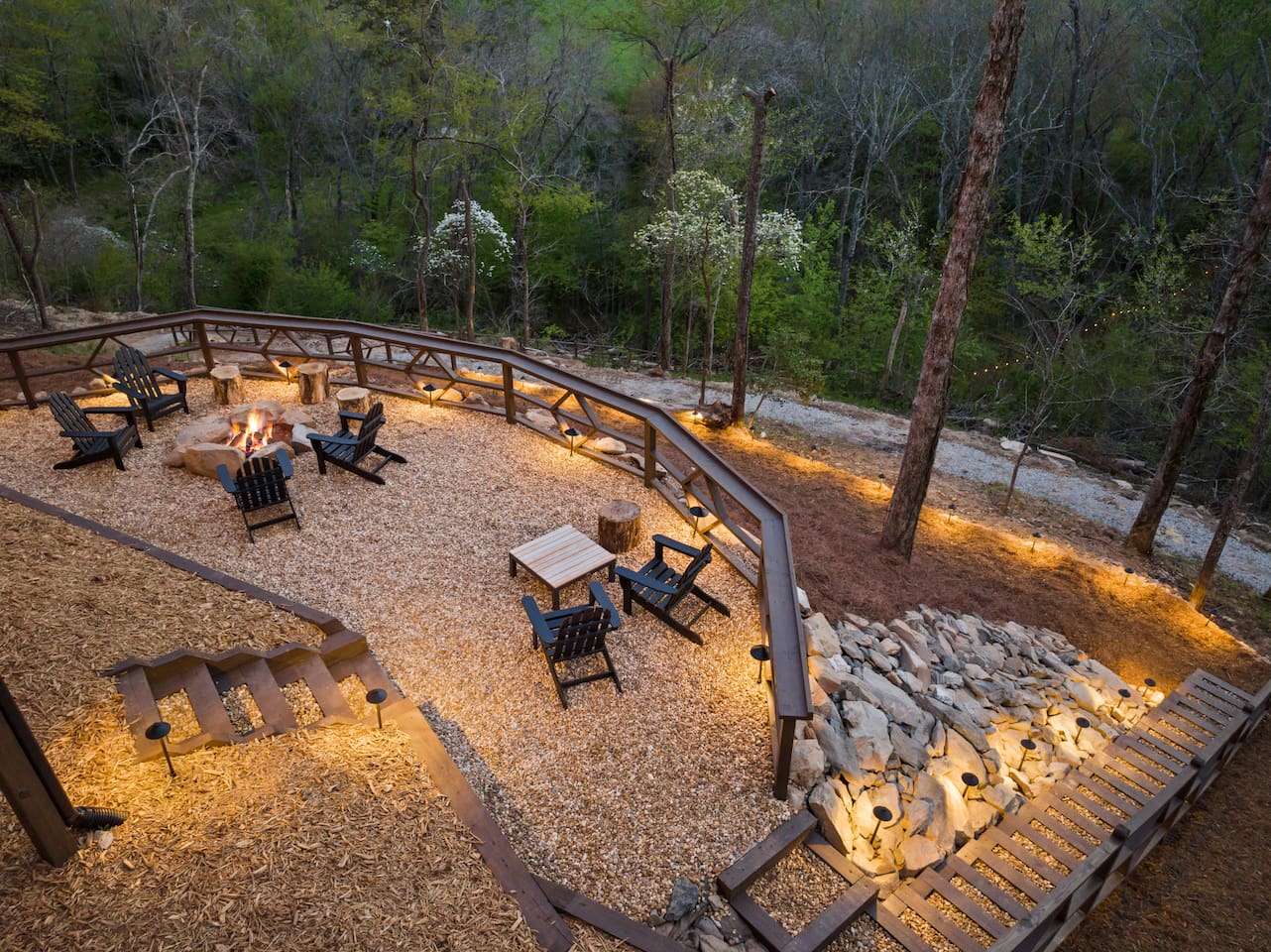 Hang out and take in the breathtaking views on the fire pit patio. The two chairs have long range mountain views and there is ample seating for the entire group at the fire pit! The railing is designed to hold drinks. S'mores are calling!