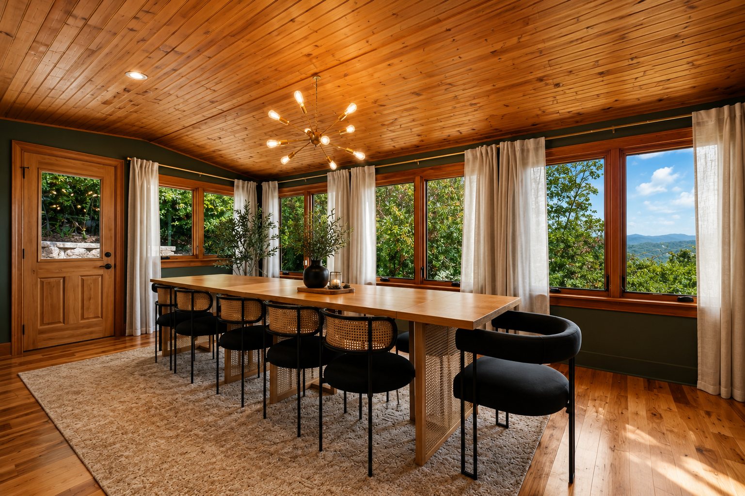 {Dining Room} Gather around the oversized dining table, framed by forest and mountain views, with seating for up to 16 guests plus additional seating in the kitchen.