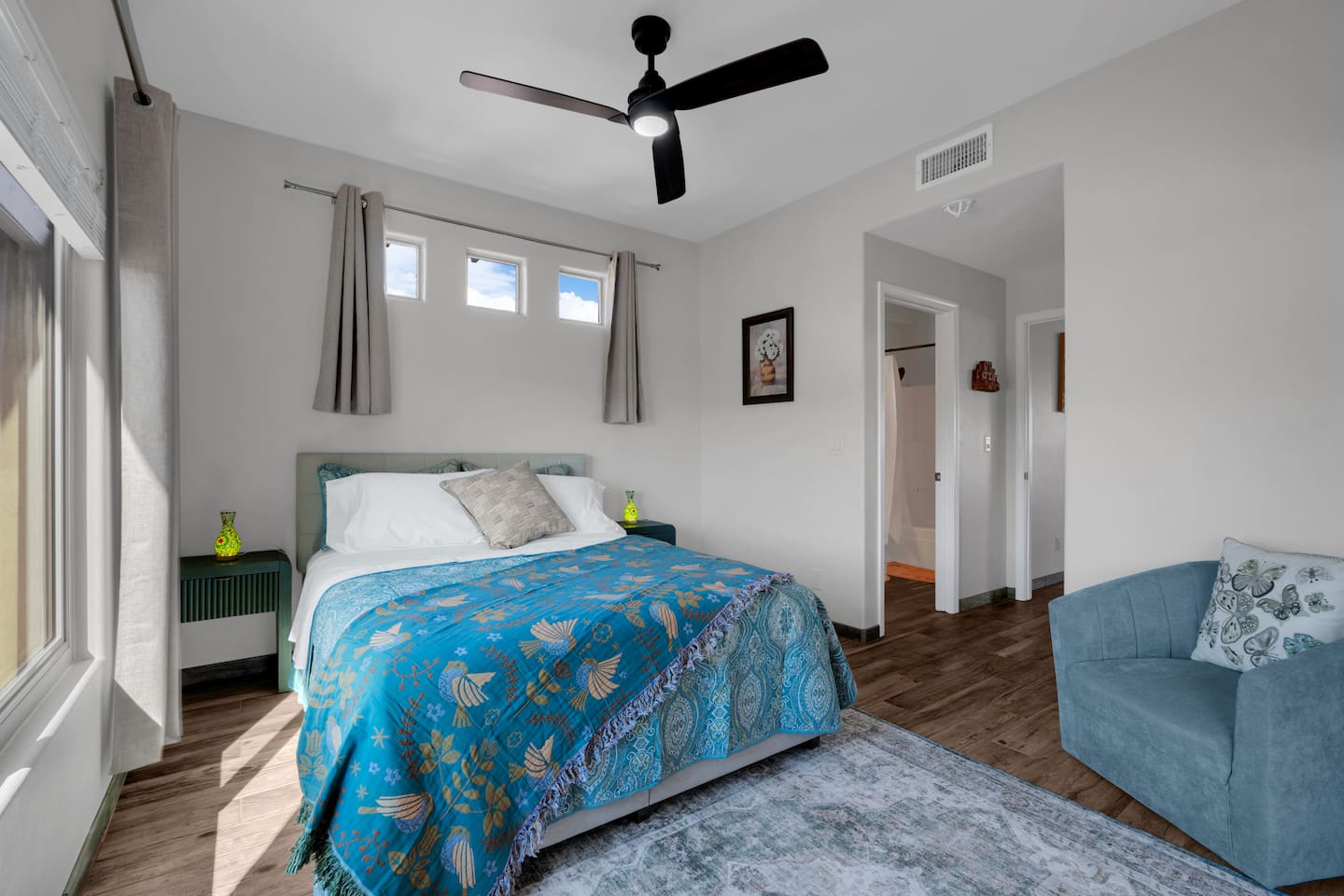 Luxurious queen bedroom with stunning mountain views, smart-TV, and work desk.