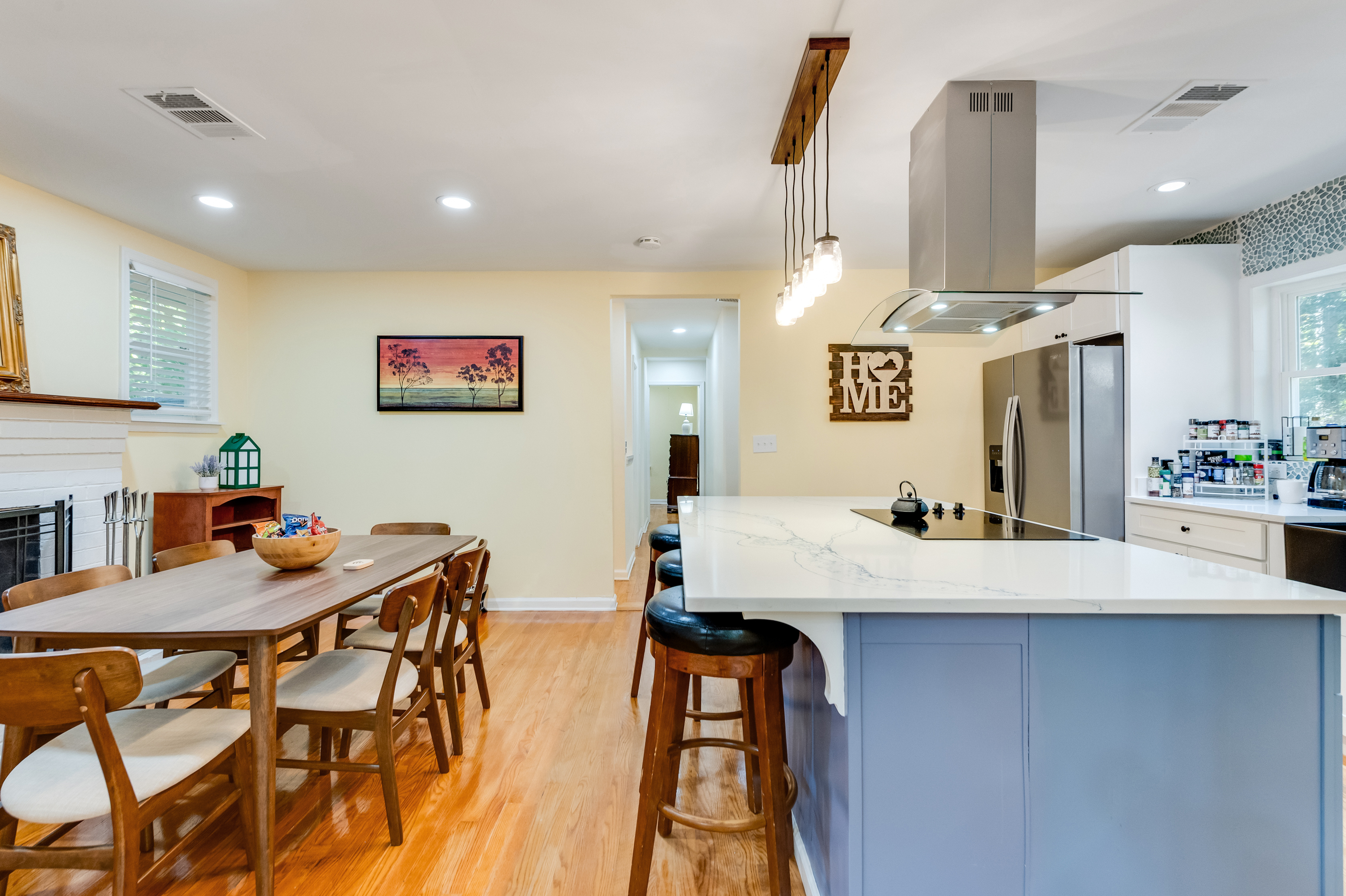 Dining Area: Enjoy meals by the fireplace in a stylish space filled with natural light! Seating for 6 and additional 3 kitchen nook seating. 