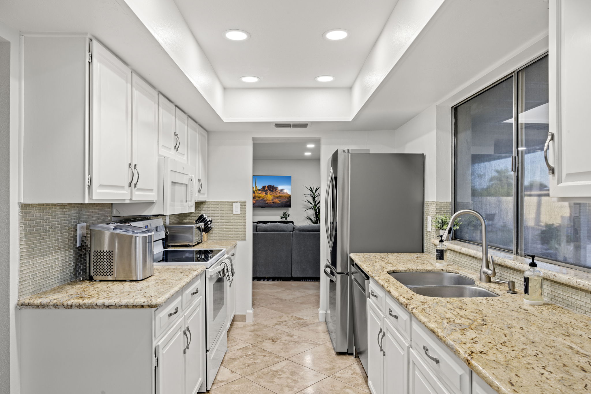 Fully equipped kitchen with ample counter space and modern appliances