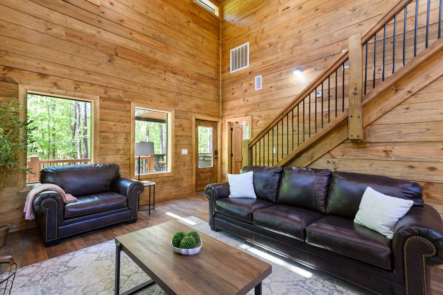 Vaulted ceilings and natural wood beams make this space feel both grand and inviting.