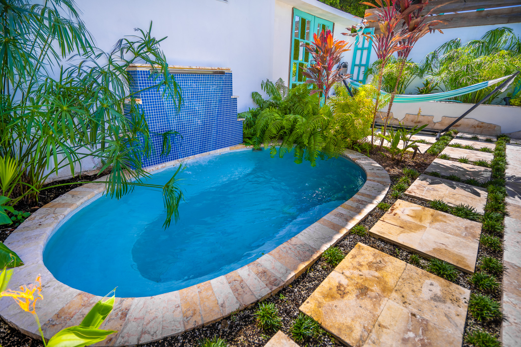 Indulge in the large salt water hot tub with wterfall after a day at the beach or rain forest in Dorado, Puerto Rico.