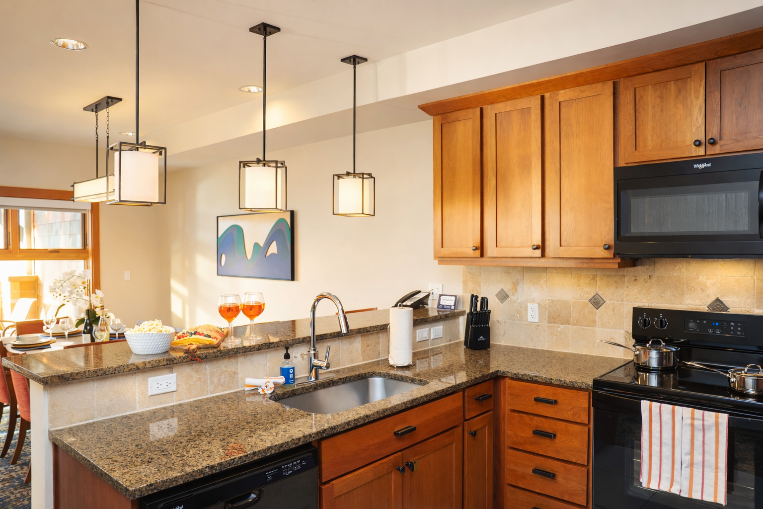 Bar area and open dining room. Dining table seats 6, bar area seats 3