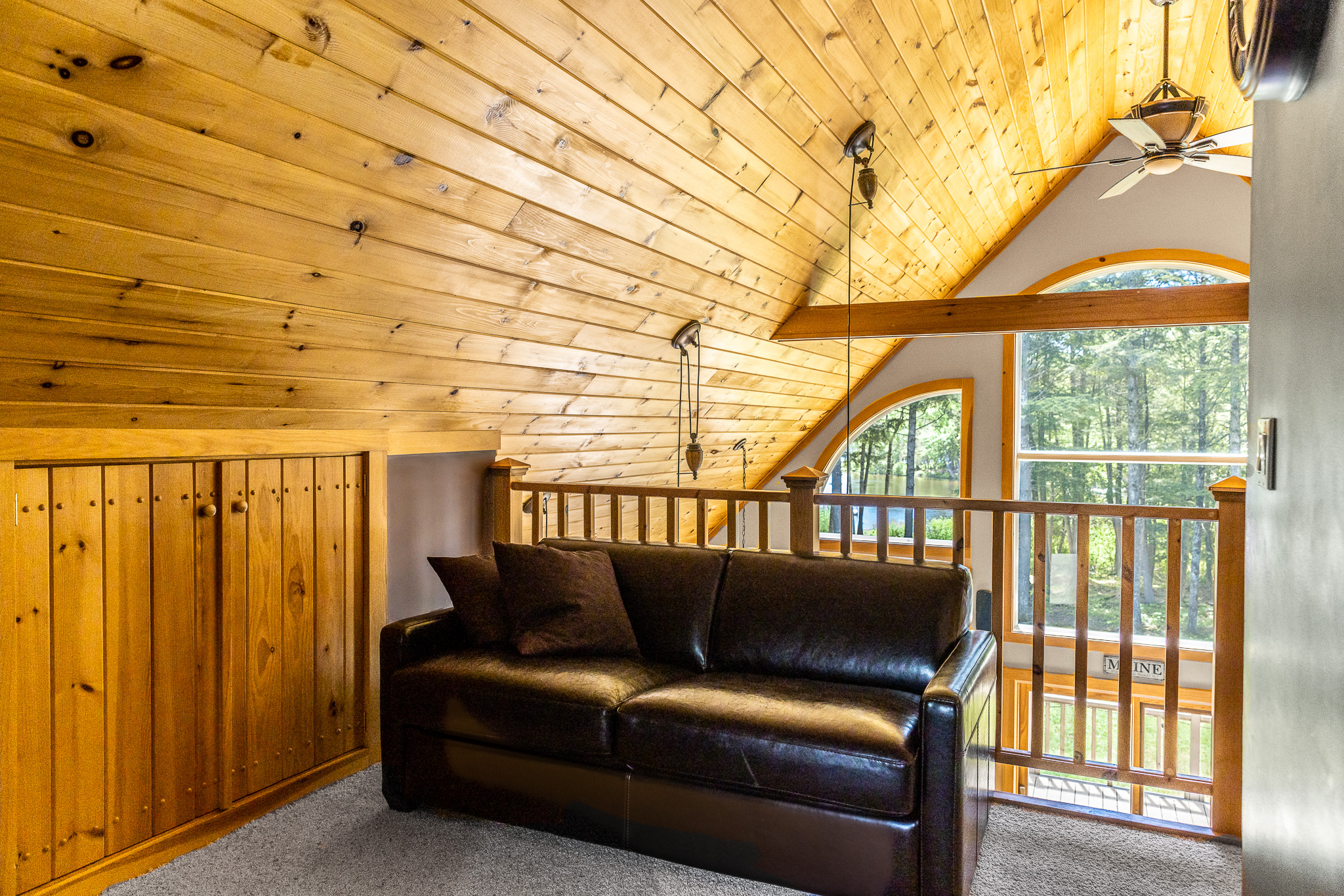 Sleeper sofa in the upstairs loft which also has a queen bed and 1/2 bathroom.