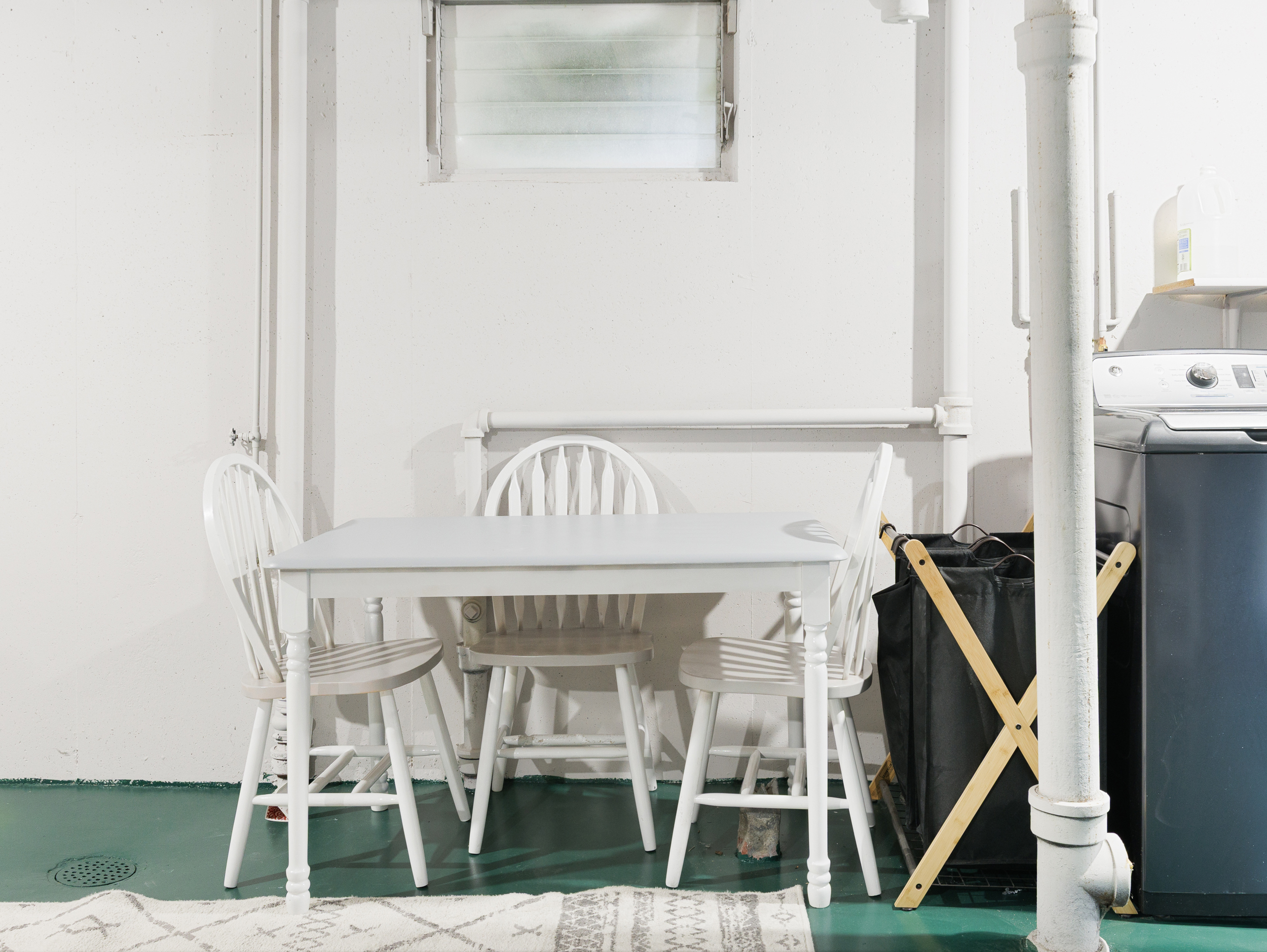 Laundry folding table and utility workspace for added functionality during longer stays.