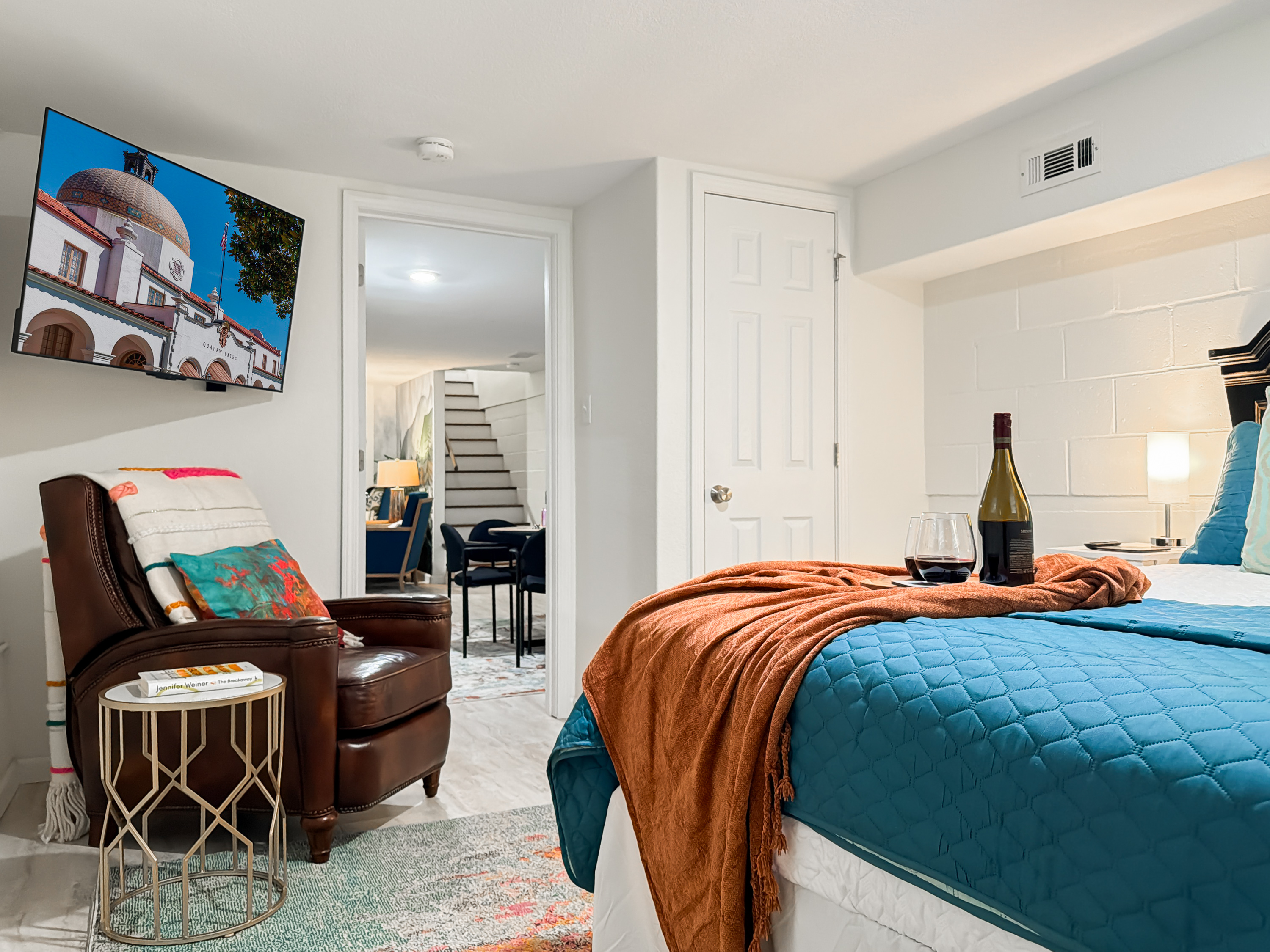 Settle into a lower-level bedroom with its own TV — a private retreat away from the main-floor bustle.
