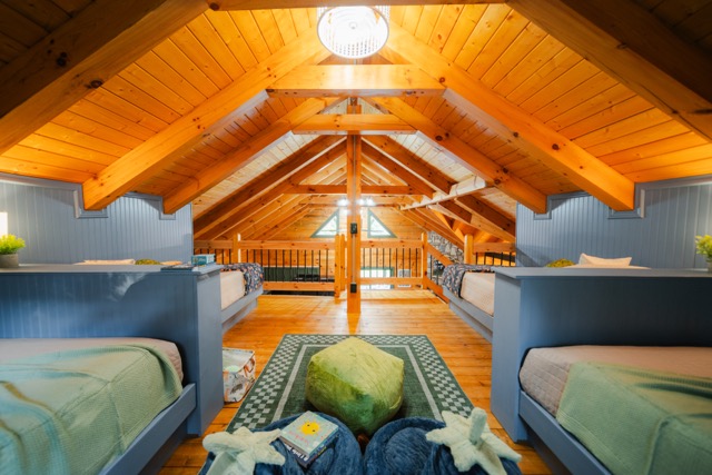 Cozy kids’ loft with custom sleeping spaces