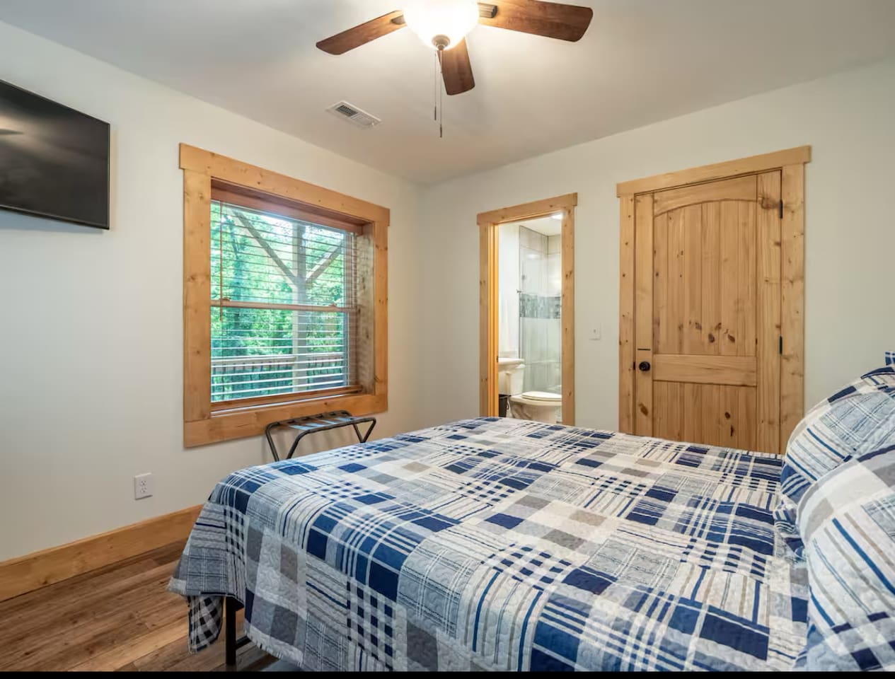 Bedroom #2 located on lower level of home / queen sized bed 