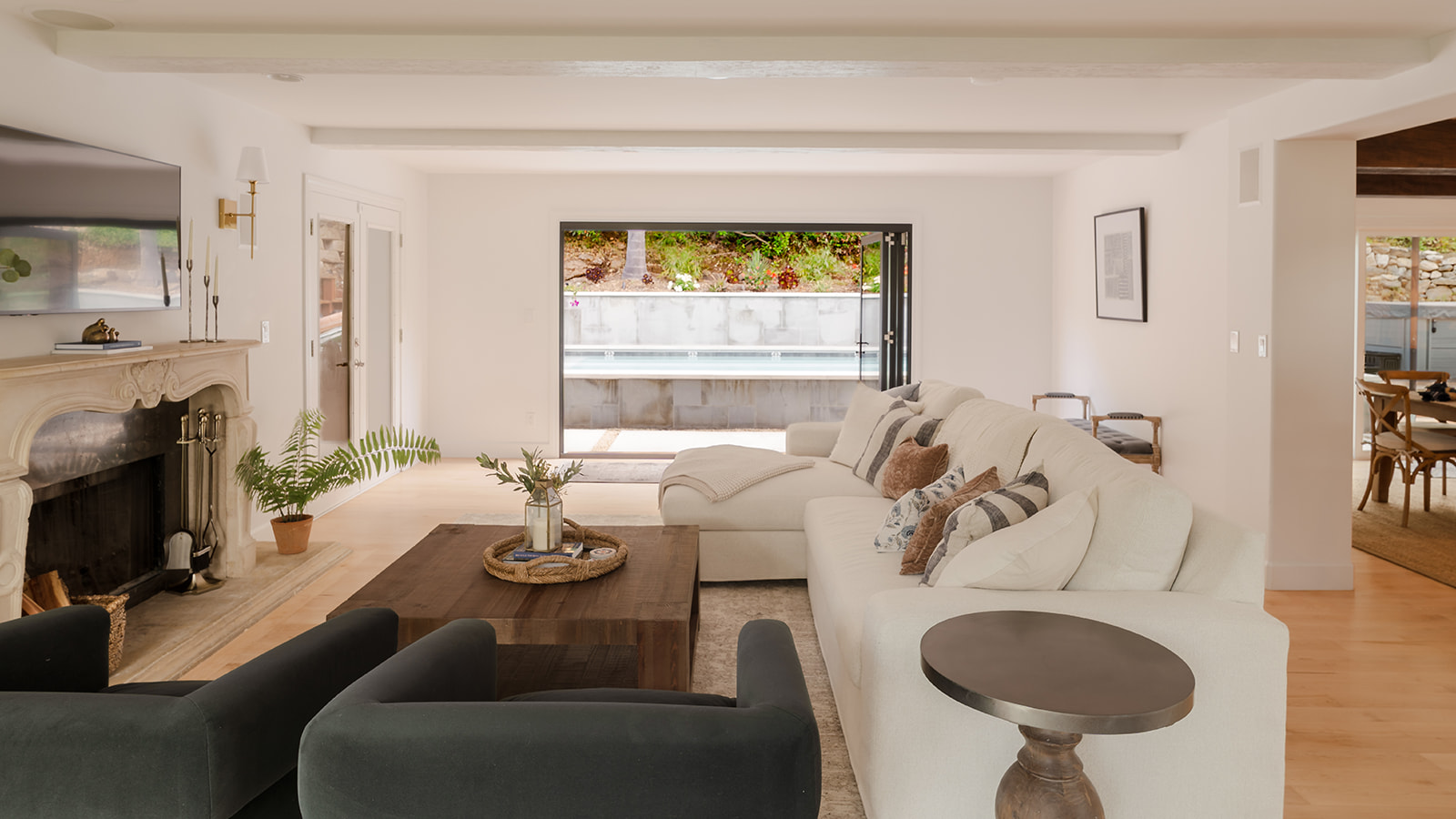 Comfortable Family Room Opens to the Pool