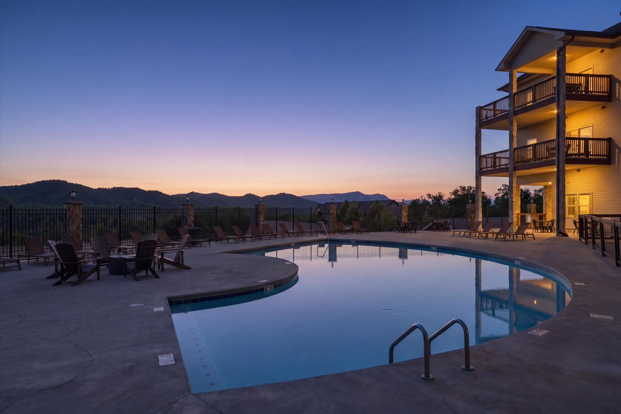 Unwind poolside as the sun sets over the mountains, bringing a calm, peaceful close to your day at the resort.