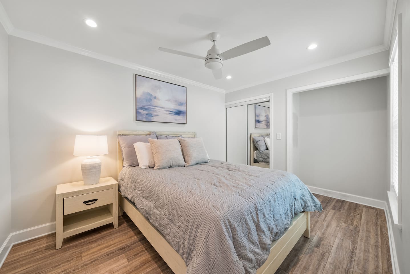 Guest room of Unit B with a queen bed. 
