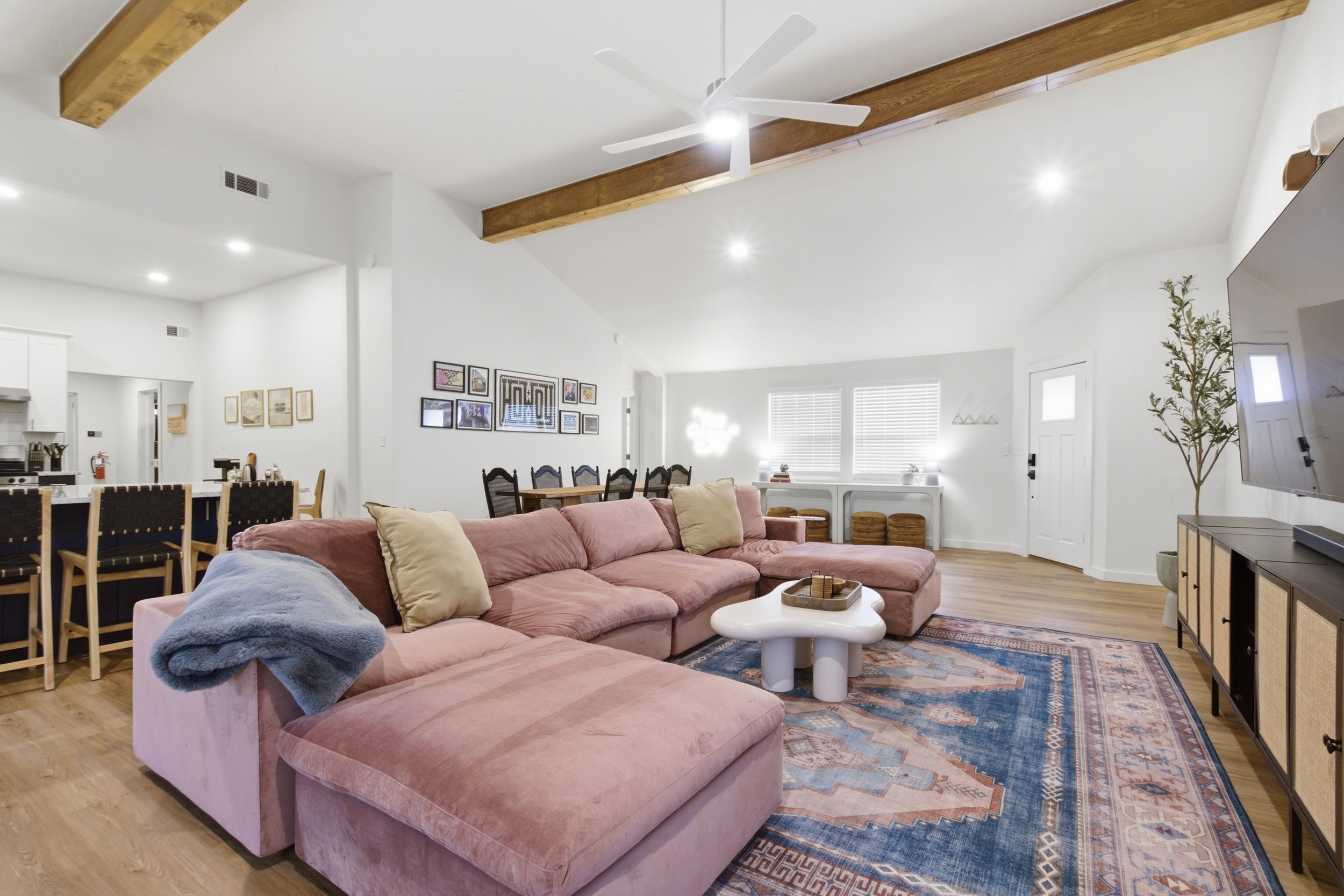 Open-concept living and dining with Private Living Room and Private Entrance. Sectional sofa, exposed beam ceiling, and Smart Lock Entry. Sleeps 8, Arlington TX.