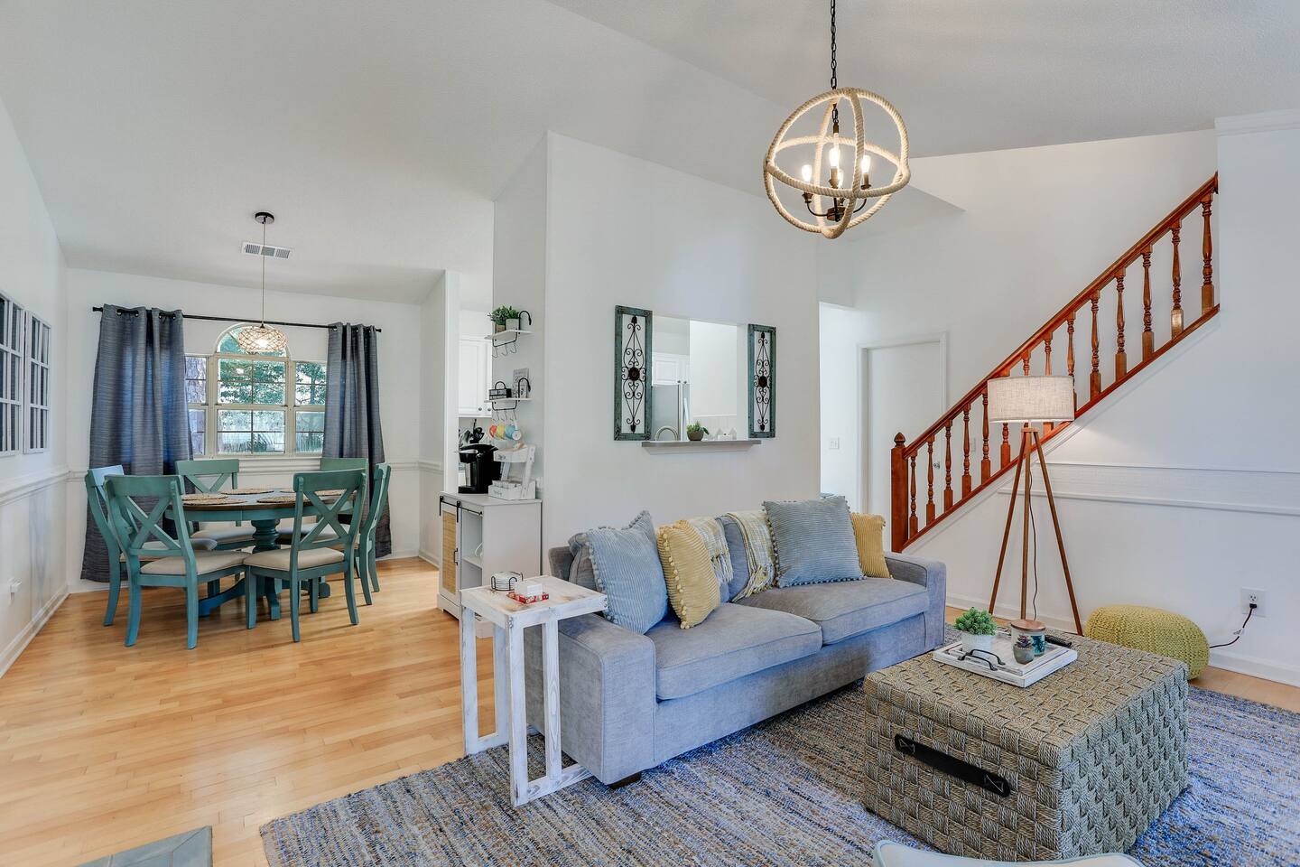 The open-concept design at seamlessly connects the living room to the dining area, creating a spacious and inviting environment perfect for family gatherings and entertaining.
