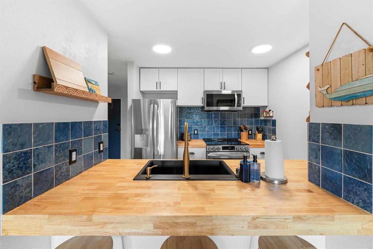 Open kitchen so you can chat while you cook