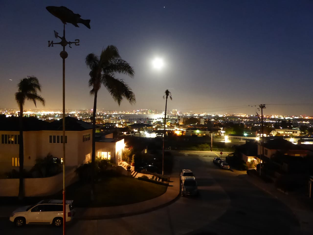 Full moon over the bay with a star above