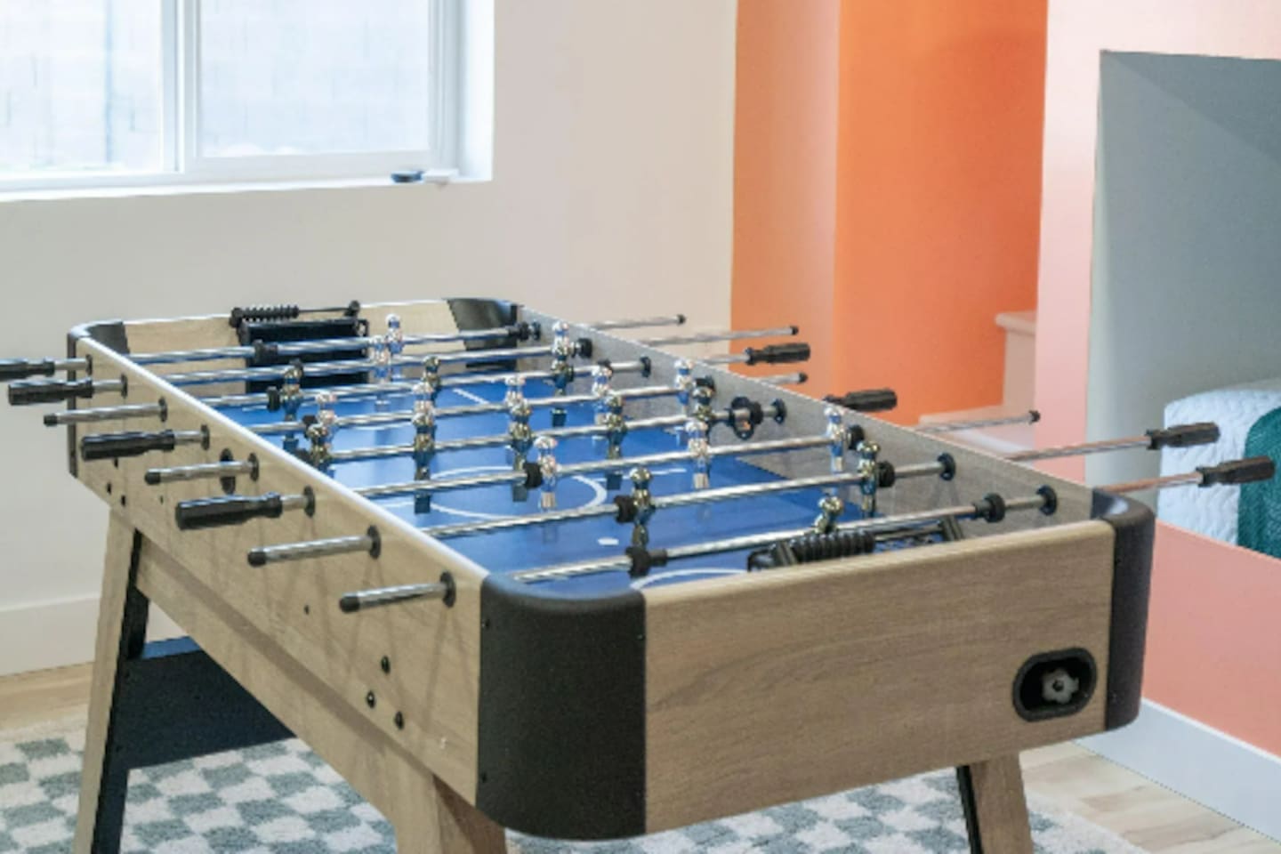 A classic foosball table adds a little friendly competition to the mix.