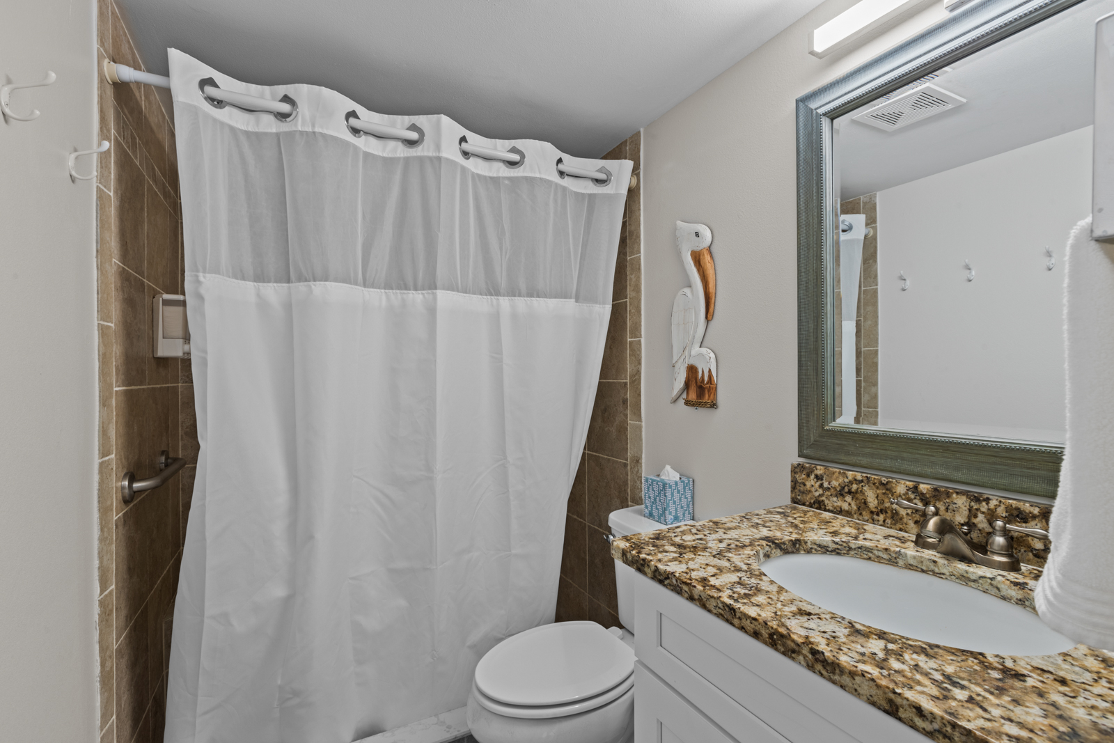 Bathroom with walk-in shower.