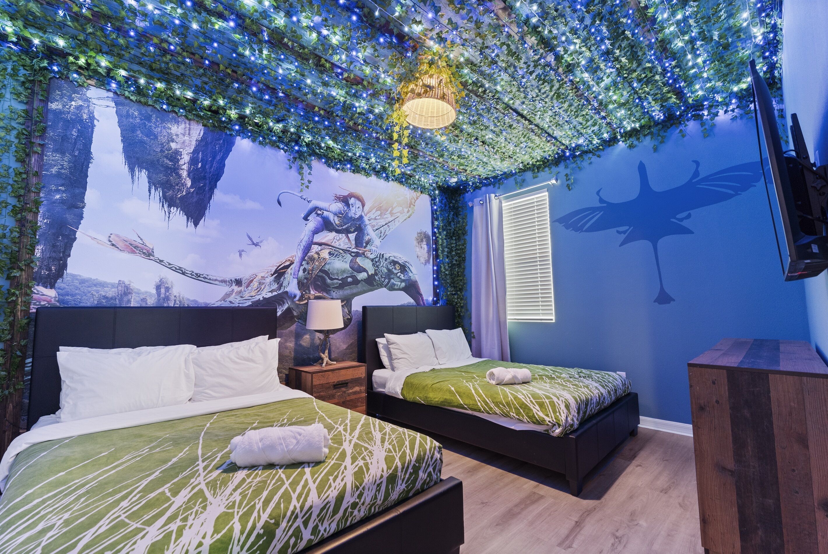 Experience the magic of Pandora! 🌌✨ This Avatar-themed room features two cozy double beds—perfect for a dreamlike getaway